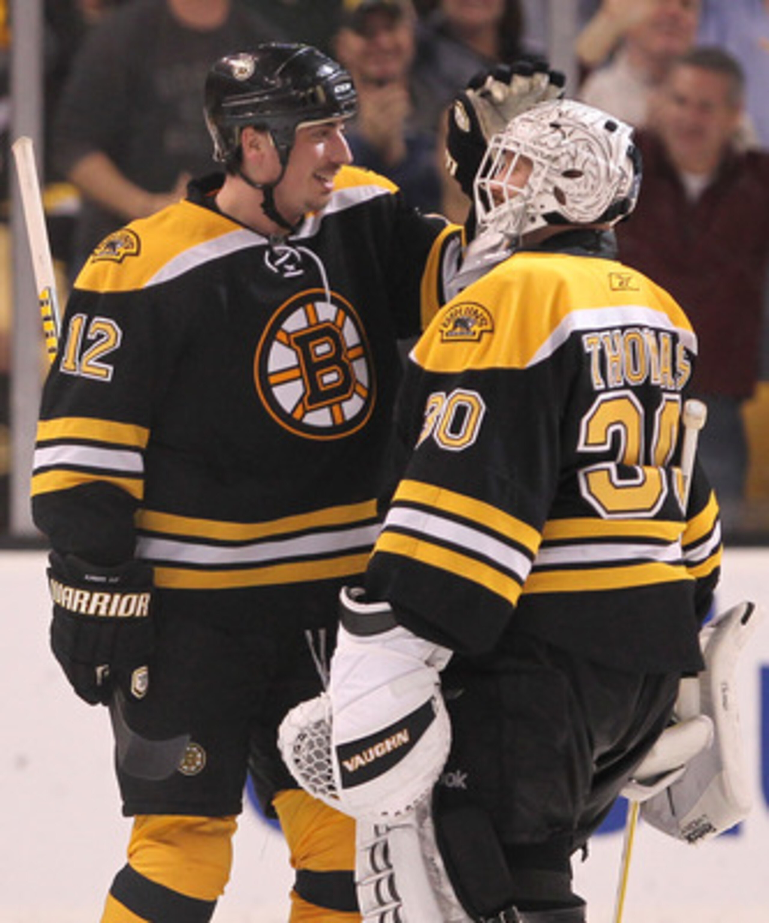 BOSTON, MA - APRIL 27:  Tomas Kaberle #12 of the Boston Bruins celebrates with goalie Tim Thomas #30 after defeating the Montreal Canadien in overtime of Game Seven of the Eastern Conference Quarterfinals during the 2011 NHL Stanley Cup Playoffs at TD Gar