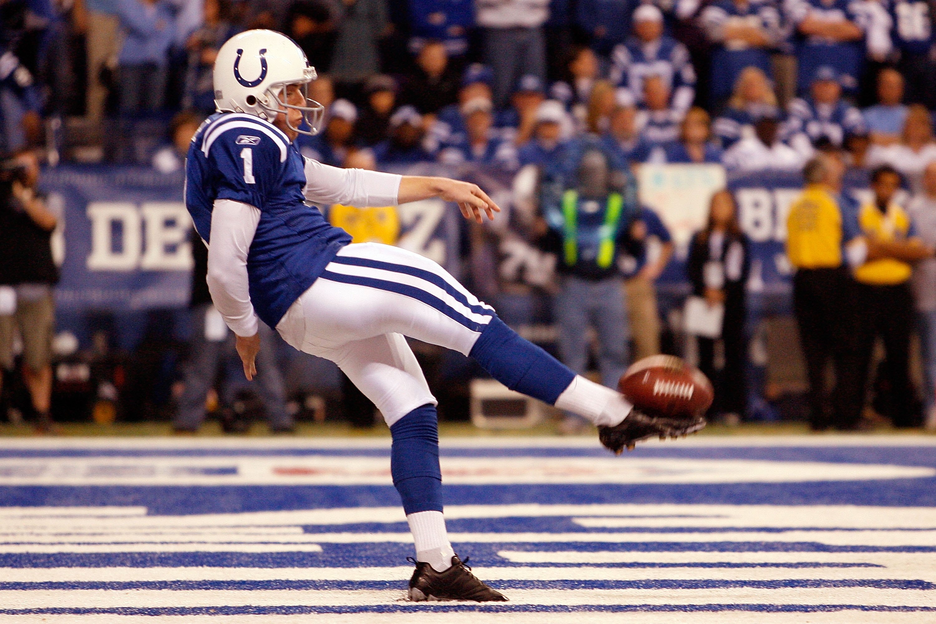 INDIANAPOLIS - JANUARY 16:  Pat McAfee #1 of the Indianapolis Colts punts the ball out of the Colts endzone against the Baltimore Ravens in the AFC Divisional Playoff Game at Lucas Oli Stadium on January 16, 2010 in Indianapolis, Indiana.  (Photo by Andy