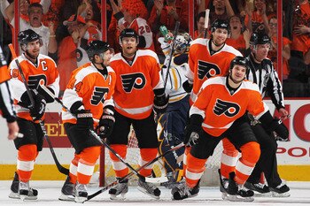 PHILADELPHIA, PA - APRIL 26:  Daniel Carcillo #13 of the Philadelphia Flyers celebrates scoring a third period goal against Jhonas Enroth #1 of the Buffalo Sabres with teammates in Game Seven of the Eastern Conference Quarterfinals during the 2011 NHL Sta