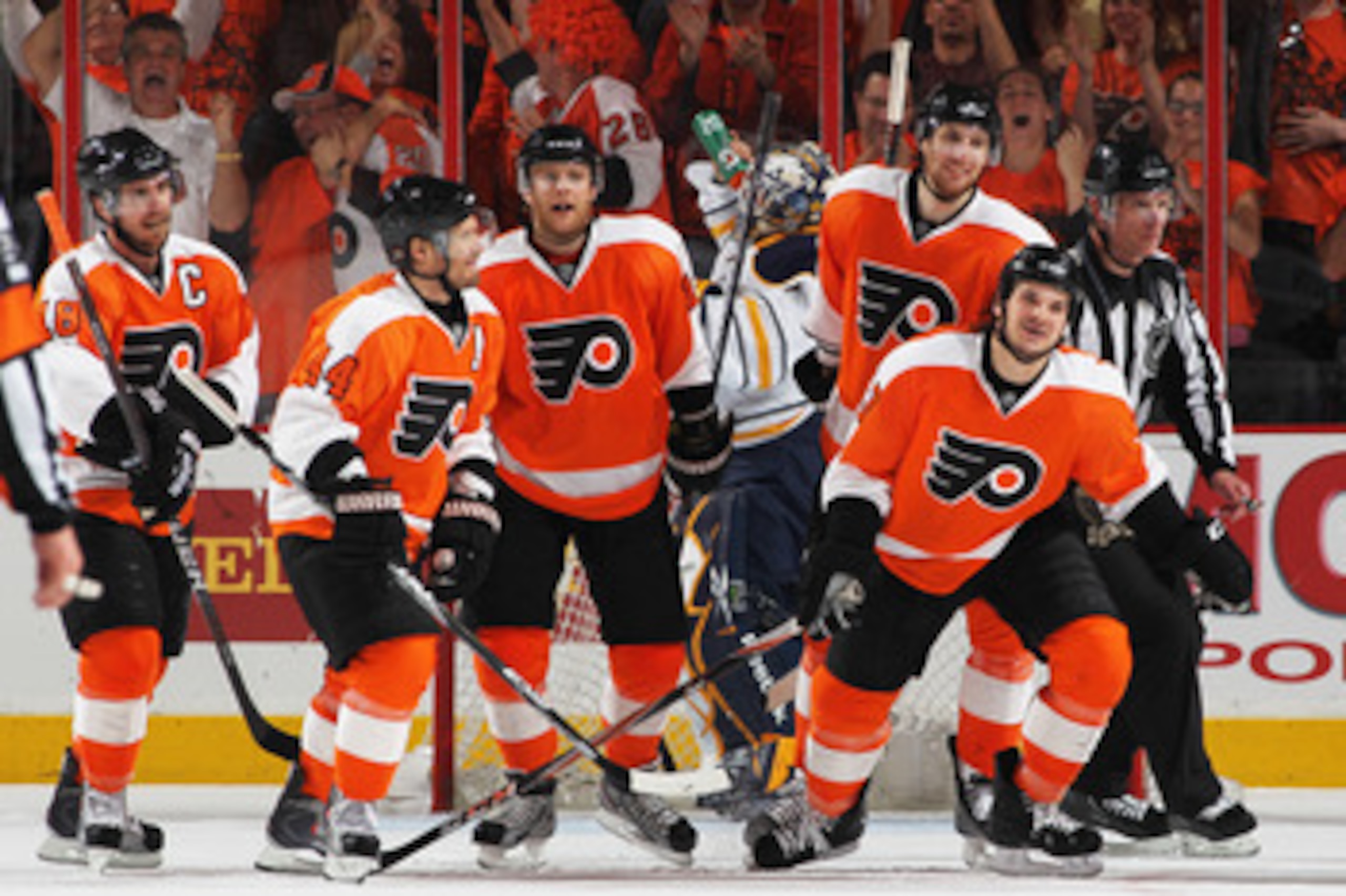 PHILADELPHIA, PA - APRIL 26:  Daniel Carcillo #13 of the Philadelphia Flyers celebrates scoring a third period goal against Jhonas Enroth #1 of the Buffalo Sabres with teammates in Game Seven of the Eastern Conference Quarterfinals during the 2011 NHL Sta