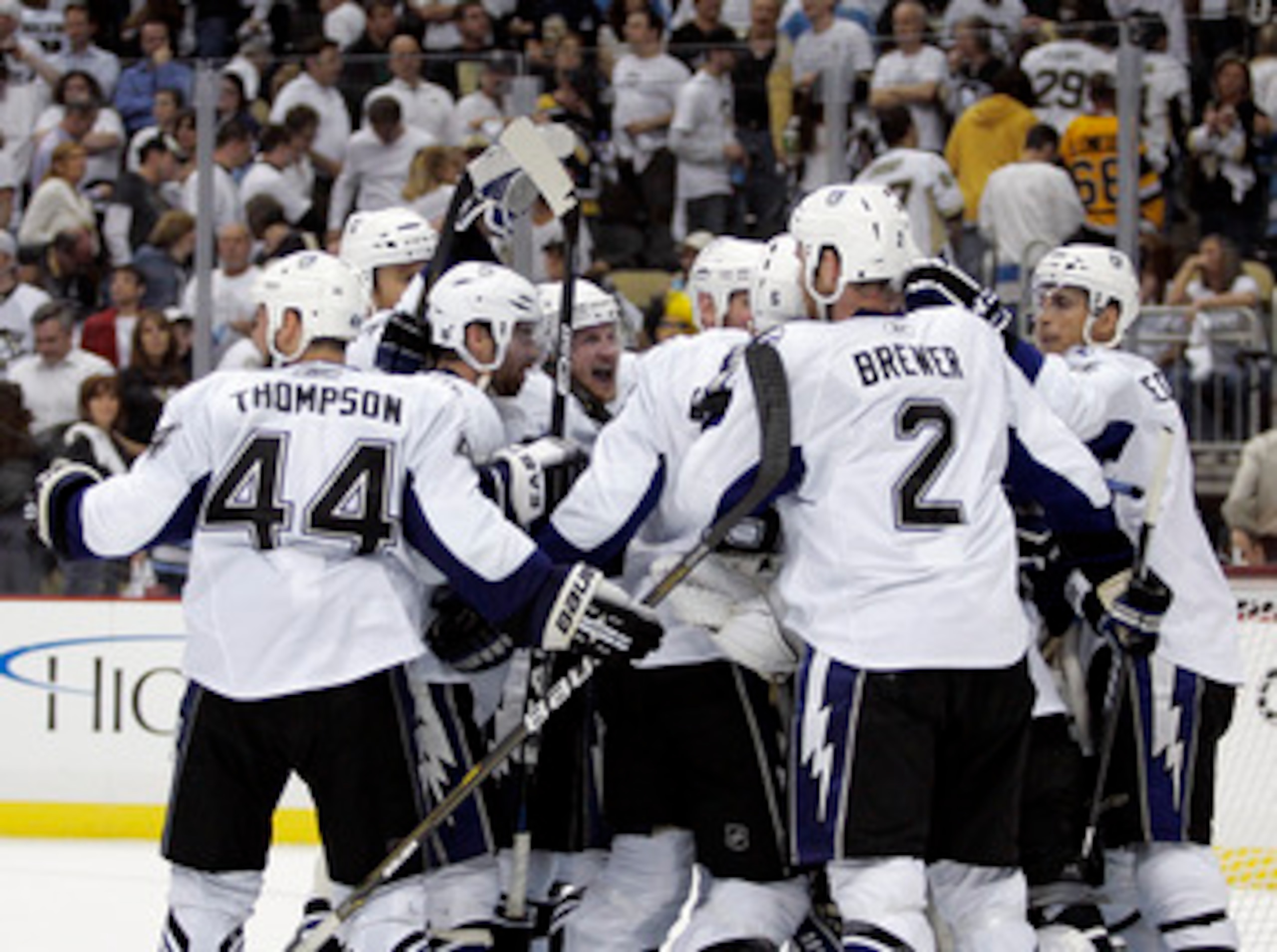PITTSBURGH, PA - APRIL 27:  Steven Stamkos #91 of the Tampa Bay Lightning (center) celebrates the win with teammates over the Pittsburgh Penguins after Game Seven of the Eastern Conference Quarterfinals during the 2011 NHL Stanley Cup Playoffs at Consol E