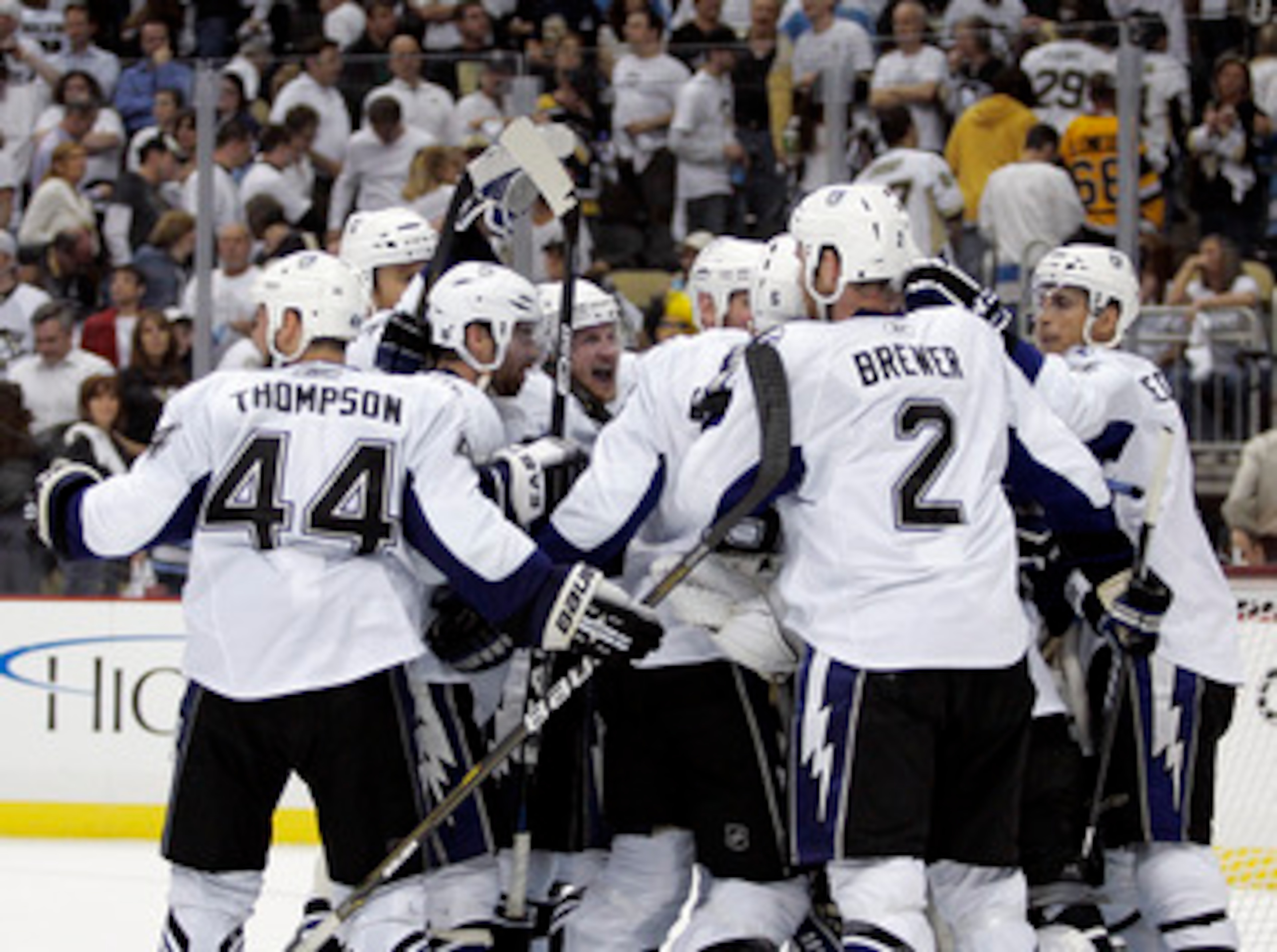 PITTSBURGH, PA - APRIL 27:  Steven Stamkos #91 of the Tampa Bay Lightning (center) celebrates the win with teammates over the Pittsburgh Penguins after Game Seven of the Eastern Conference Quarterfinals during the 2011 NHL Stanley Cup Playoffs at Consol E