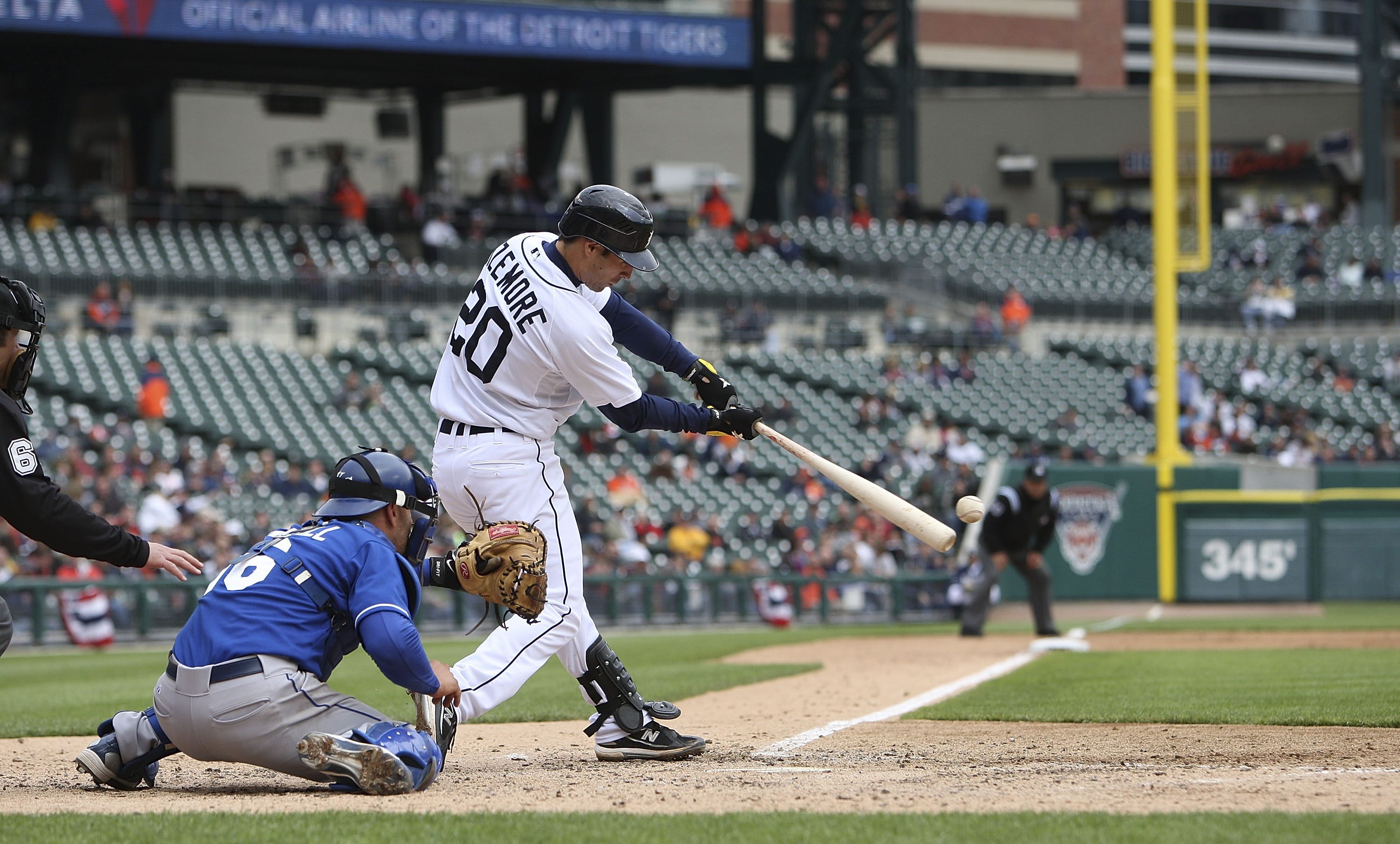 DETROIT - APRIL 13: Scott Sizemore #20 of the Detroit Tigers doubles down the left field line in the seventh inning scoring Gerald Laird #8 from second base against the Kansas City Royals on April 13, 2010 at Comerica Park in Detroit, Michigan. The Detroi