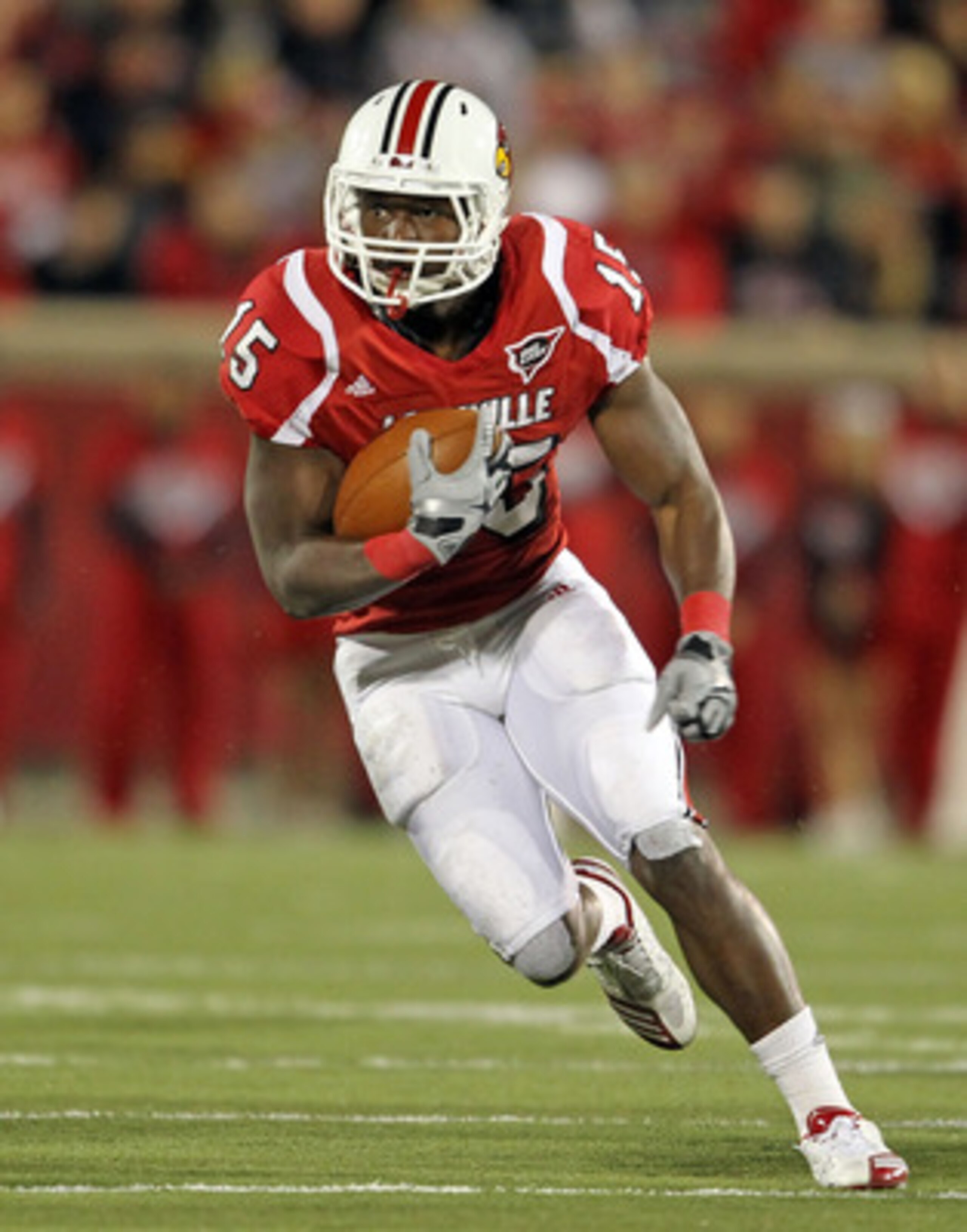 LOUISVILLE, KY - OCTOBER 15: Bilal Powell #15 of the Louisville Cardinals runs with the ball during the Big East Conference game against the Cincinnati Bearcats at Papa John's Cardinal Stadium on October 15, 2010 in Louisville, Kentucky. (Photo by Andy LOUISVILLE, KY - OCTOBER 15: Bilal Powell #15 of the Louisville Cardinals runs with the ball during the Big East Conference game against the Cincinnati Bearcats at Papa John's Cardinal Stadium on October 15, 2010 in Louisville, Kentucky. (Photo by Andy