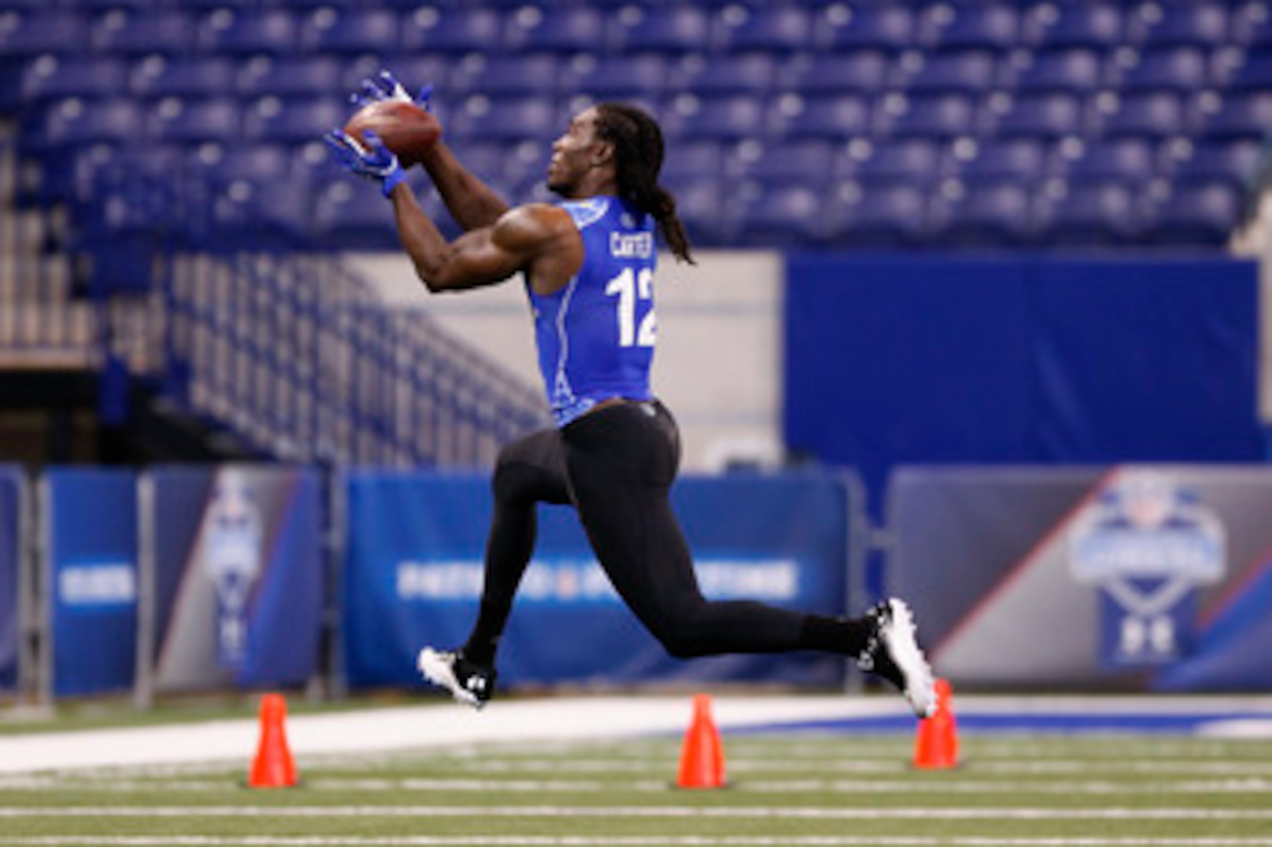 INDIANAPOLIS, IN - MARCH 1: Defensive back Quinton Carter #12 of Oklahoma works out during the 2011 NFL Scouting Combine at Lucas Oil Stadium on February 28, 2011 in Indianapolis, Indiana. (Photo by Joe Robbins/Getty Images) INDIANAPOLIS, IN - MARCH 1: Defensive back Quinton Carter #12 of Oklahoma works out during the 2011 NFL Scouting Combine at Lucas Oil Stadium on February 28, 2011 in Indianapolis, Indiana. (Photo by Joe Robbins/Getty Images)