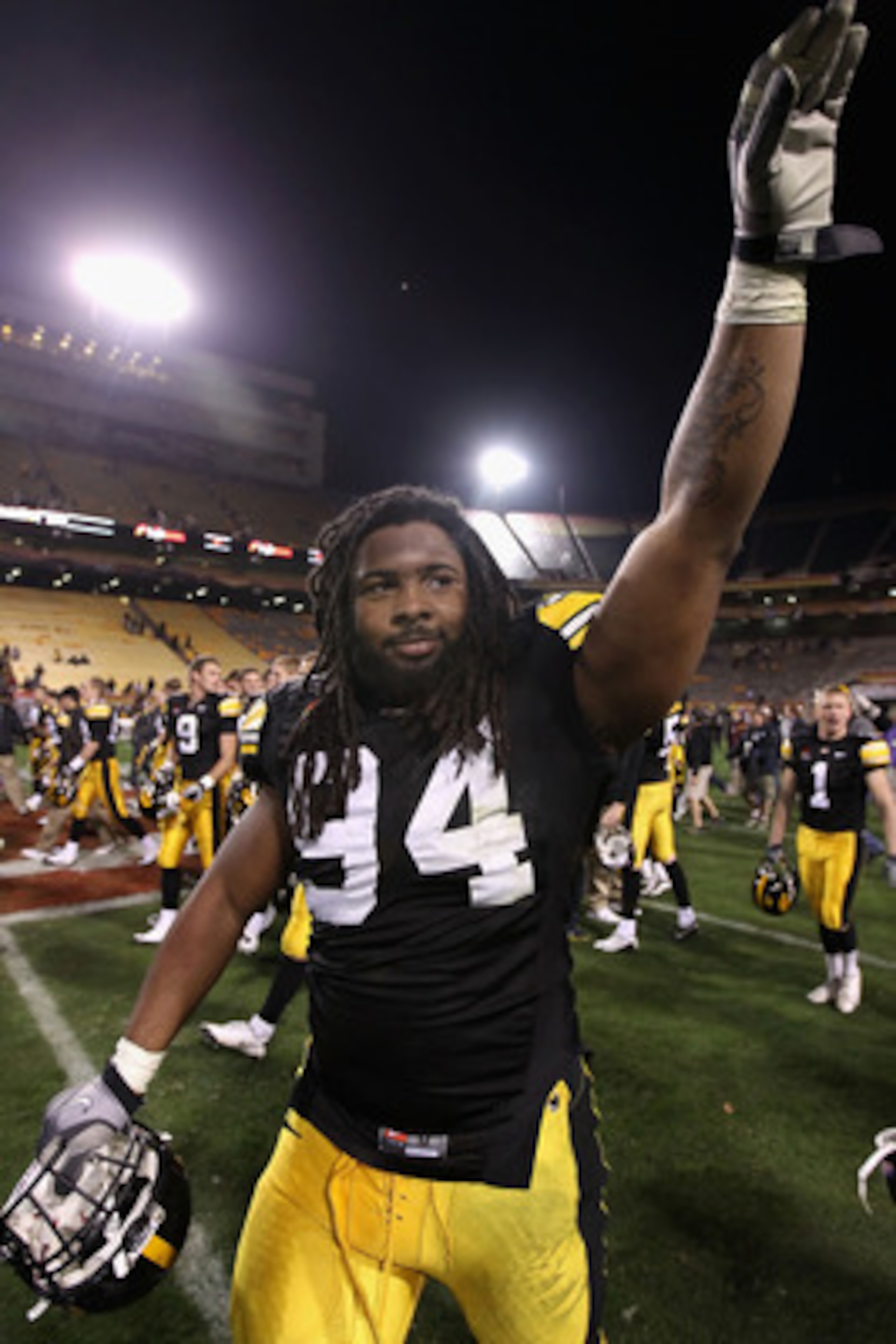 TEMPE, AZ - DECEMBER 28: Defensive end Adrian Clayborn #94 of the Iowa Hawkeyes waves to fans as he walks off the field after defeating the Missouri Tigers in the Insight Bowl at Sun Devil Stadium on December 28, 2010 in Tempe, Arizona. The Hawkeyes defe TEMPE, AZ - DECEMBER 28: Defensive end Adrian Clayborn #94 of the Iowa Hawkeyes waves to fans as he walks off the field after defeating the Missouri Tigers in the Insight Bowl at Sun Devil Stadium on December 28, 2010 in Tempe, Arizona. The Hawkeyes defe