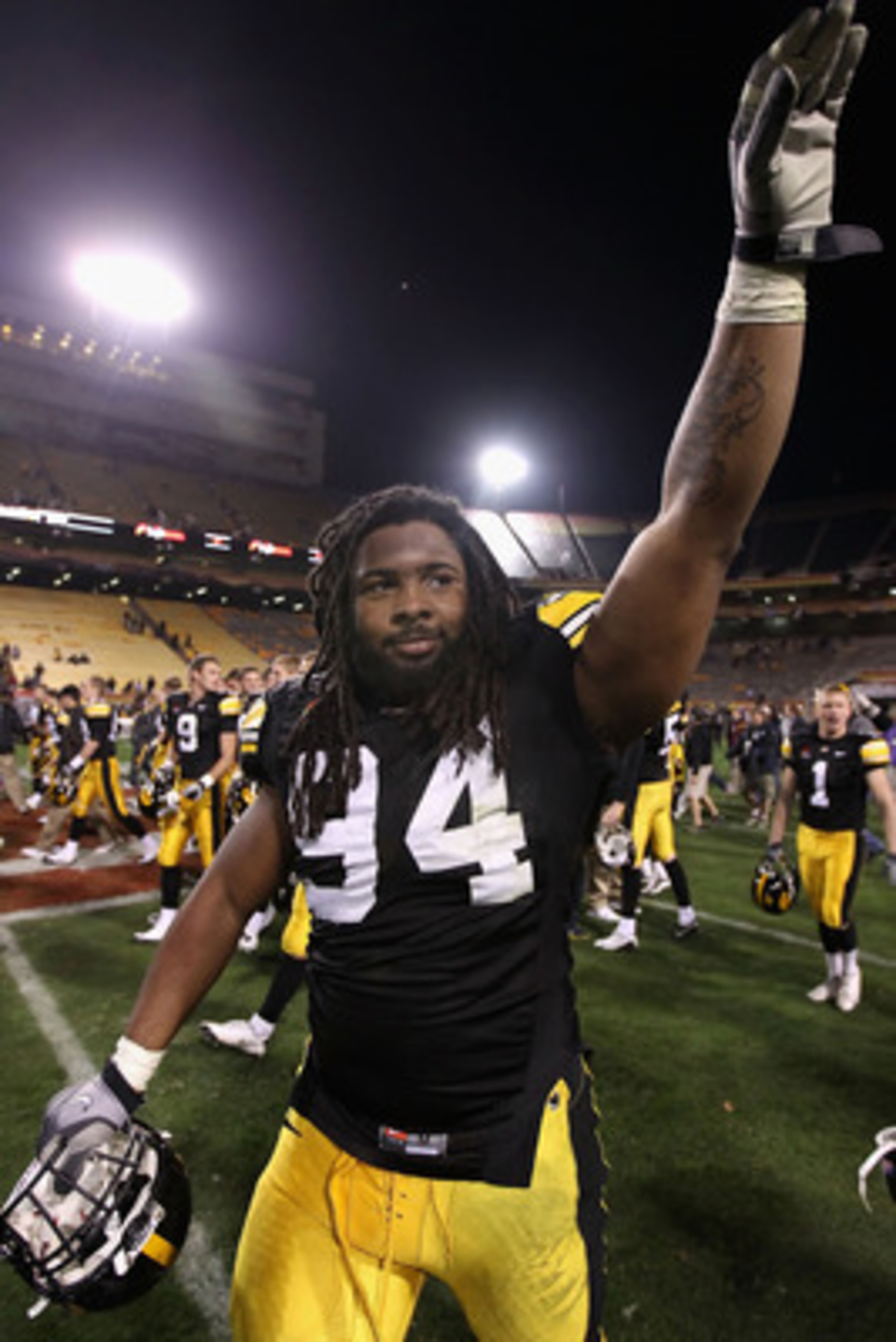 TEMPE, AZ - DECEMBER 28: Defensive end Adrian Clayborn #94 of the Iowa Hawkeyes waves to fans as he walks off the field after defeating the Missouri Tigers in the Insight Bowl at Sun Devil Stadium on December 28, 2010 in Tempe, Arizona. The Hawkeyes defe TEMPE, AZ - DECEMBER 28: Defensive end Adrian Clayborn #94 of the Iowa Hawkeyes waves to fans as he walks off the field after defeating the Missouri Tigers in the Insight Bowl at Sun Devil Stadium on December 28, 2010 in Tempe, Arizona. The Hawkeyes defe