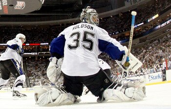 PITTSBURGH, PA - APRIL 27:  Dwayne Roloson #35 of the Tampa Bay Lightning protects the net against the Pittsburgh Penguins in Game Seven of the Eastern Conference Quarterfinals during the 2011 NHL Stanley Cup Playoffs at Consol Energy Center on April 27, 