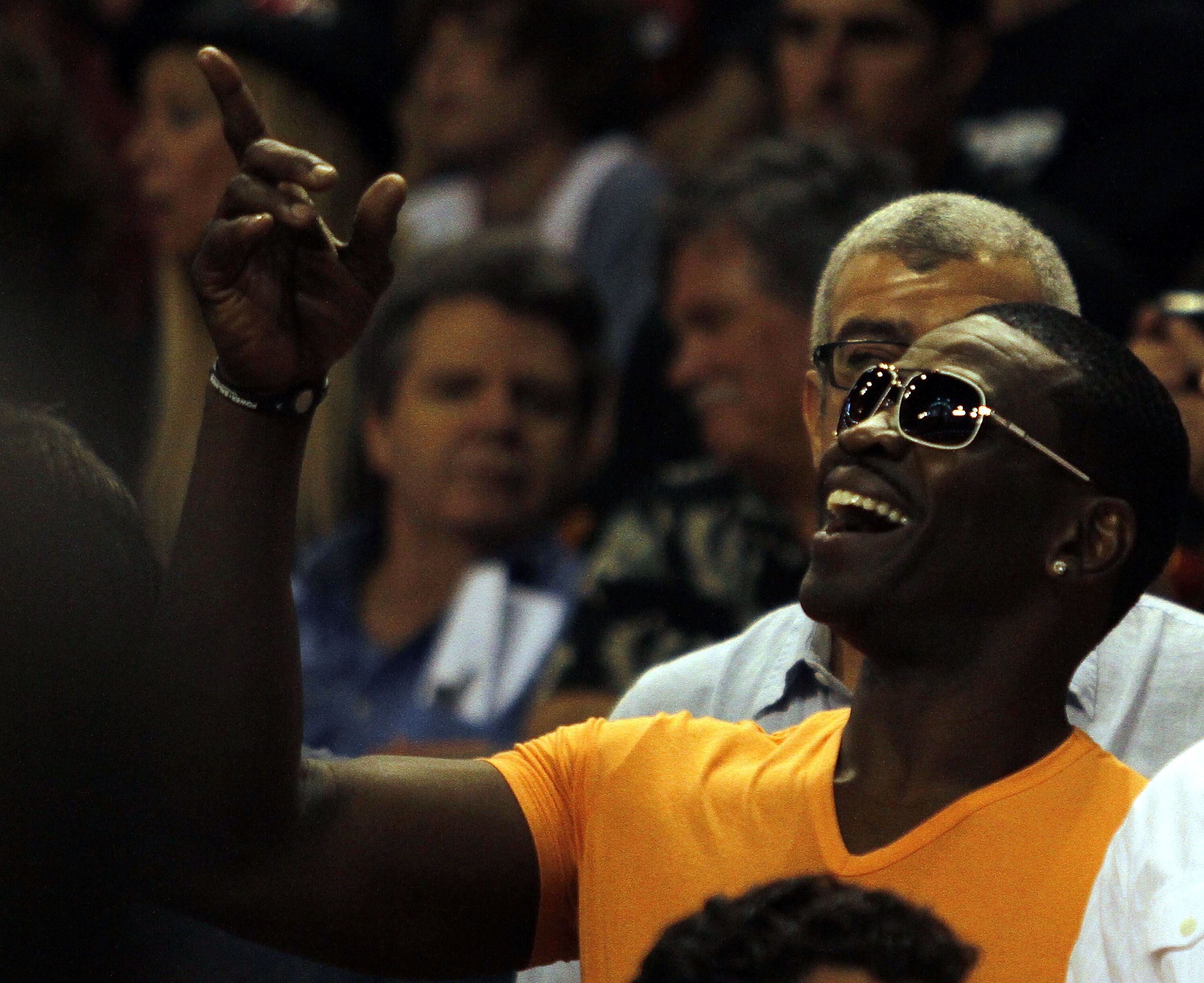 MIAMI - OCTOBER 29: Former NFL Hall of Fame receiver Michael Irvin points prior to the Miami Heat's game against the Orlando Magic at American Airlines Arena on October 29, 2010 in Miami, Florida.  NOTE TO USER: User expressly acknowledges and agrees that