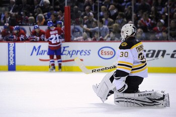 MONTREAL, CANADA - APRIL 26:  Tim Thomas #30 of the Boston Bruins stretches during a TV timeout in Game Six of the Eastern Conference Quarterfinals against the Montreal Canadiens during the 2011 NHL Stanley Cup Playoffs at the Bell Centre on April 26, 201