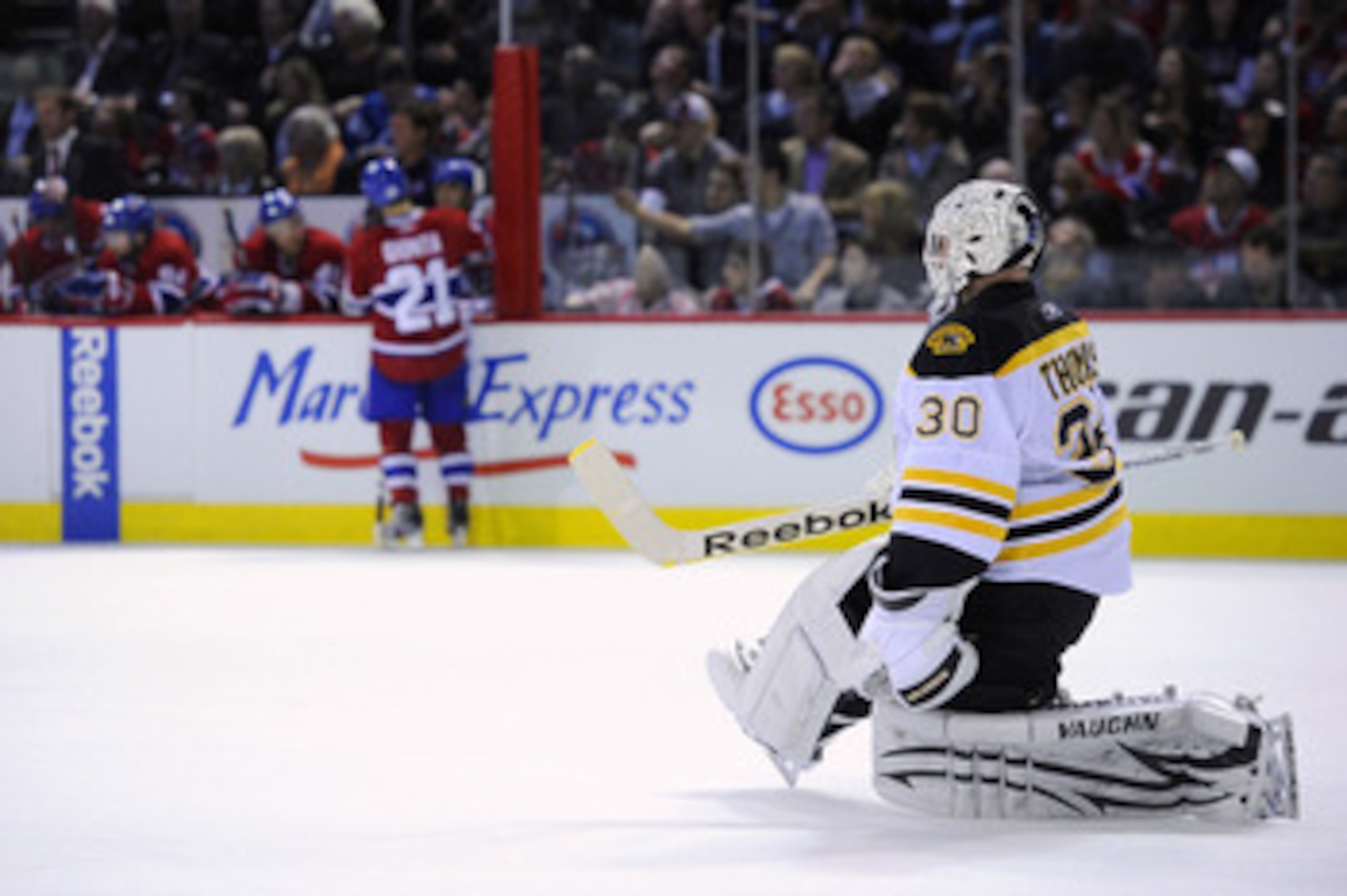 MONTREAL, CANADA - APRIL 26:  Tim Thomas #30 of the Boston Bruins stretches during a TV timeout in Game Six of the Eastern Conference Quarterfinals against the Montreal Canadiens during the 2011 NHL Stanley Cup Playoffs at the Bell Centre on April 26, 201