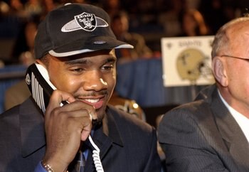 18 Apr 1998:  Fourth overall pick Charles Woodson talks on the phone after being selected by the Oakland Raiders in the first round of the 1998 NFL Draft at Madison Square Garden in Manhattan, New York. Mandatory Credit: Ezra C. Shaw  /Allsport