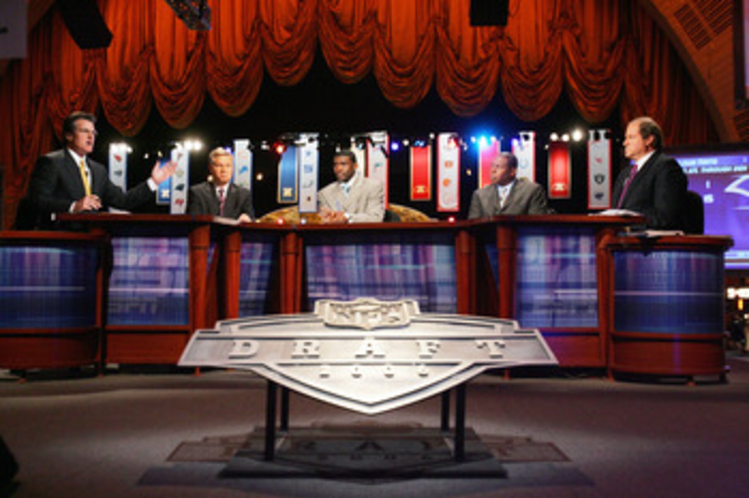 NEW YORK - APRIL 29: (L-R) Mel Kiper, Chris Mortensen, Michael Irvin, Tom Jackson and Chris Berman of ESPN broadcast their coverage during the 2006 NFL Draft on April 29, 2006 at Radio City Music Hall in New York, New York. (Photo by Chris Trotman/Getty NEW YORK - APRIL 29: (L-R) Mel Kiper, Chris Mortensen, Michael Irvin, Tom Jackson and Chris Berman of ESPN broadcast their coverage during the 2006 NFL Draft on April 29, 2006 at Radio City Music Hall in New York, New York. (Photo by Chris Trotman/Getty