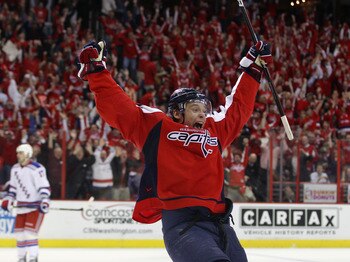 WASHINGTON, DC - APRIL 13:  Alexander Semin #28 of the Washington Capitals scores the game winning goal at 18:24 of overtime against the New York Rangers in Game One of the Eastern Conference Quarterfinals during the 2011 NHL Stanley Cup Playoffs at Veriz