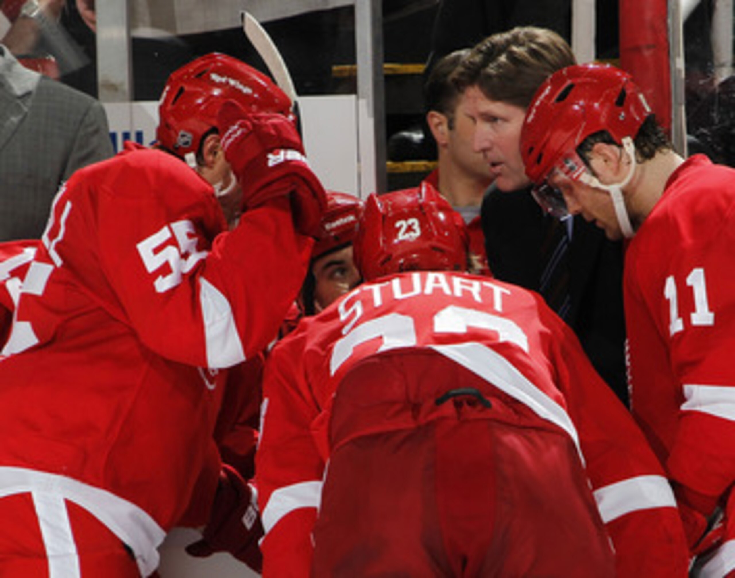 DETROIT, MI - APRIL 16:  Head coach Mike Babcock of the Detroit Red Wings talks with Niklas Kronwall #55, Brad Stuart #23 and Danny Cleary #11 of the Red Wings while playing the Phoenix Coyotes in Game Two of the Western Conference Quarterfinals during th