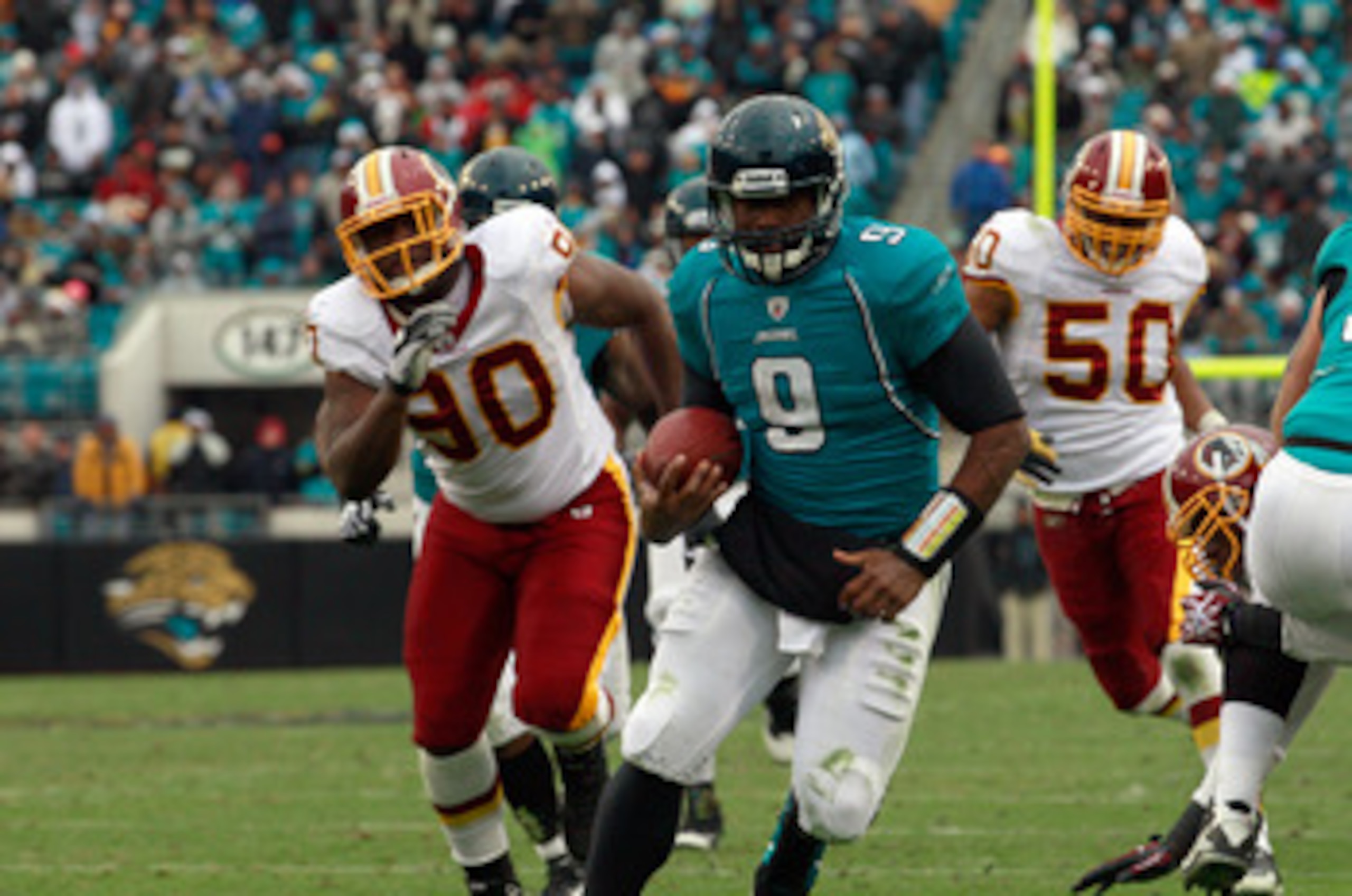 JACKSONVILLE, FL - DECEMBER 26: Quarterback David Garrard #9 of the Jacksonville Jaguars runs for a touchdaown during the game against the Washington Redskins at EverBank Field on December 26, 2010 in Jacksonville, Florida.  (Photo by Sam Greenwood/Getty 