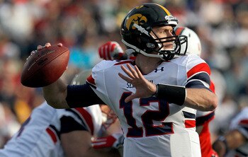 MOBILE, AL - JANUARY 29: Quarterback Ricky Stanzi #12 of the North Team passes over South Team defenders during second quarter of the Under Armour Senior Bowl on January 29, 2011 at Ladd Peebles Stadium in Mobile, Alabama.  (Photo by Sean Gardner/Getty Im