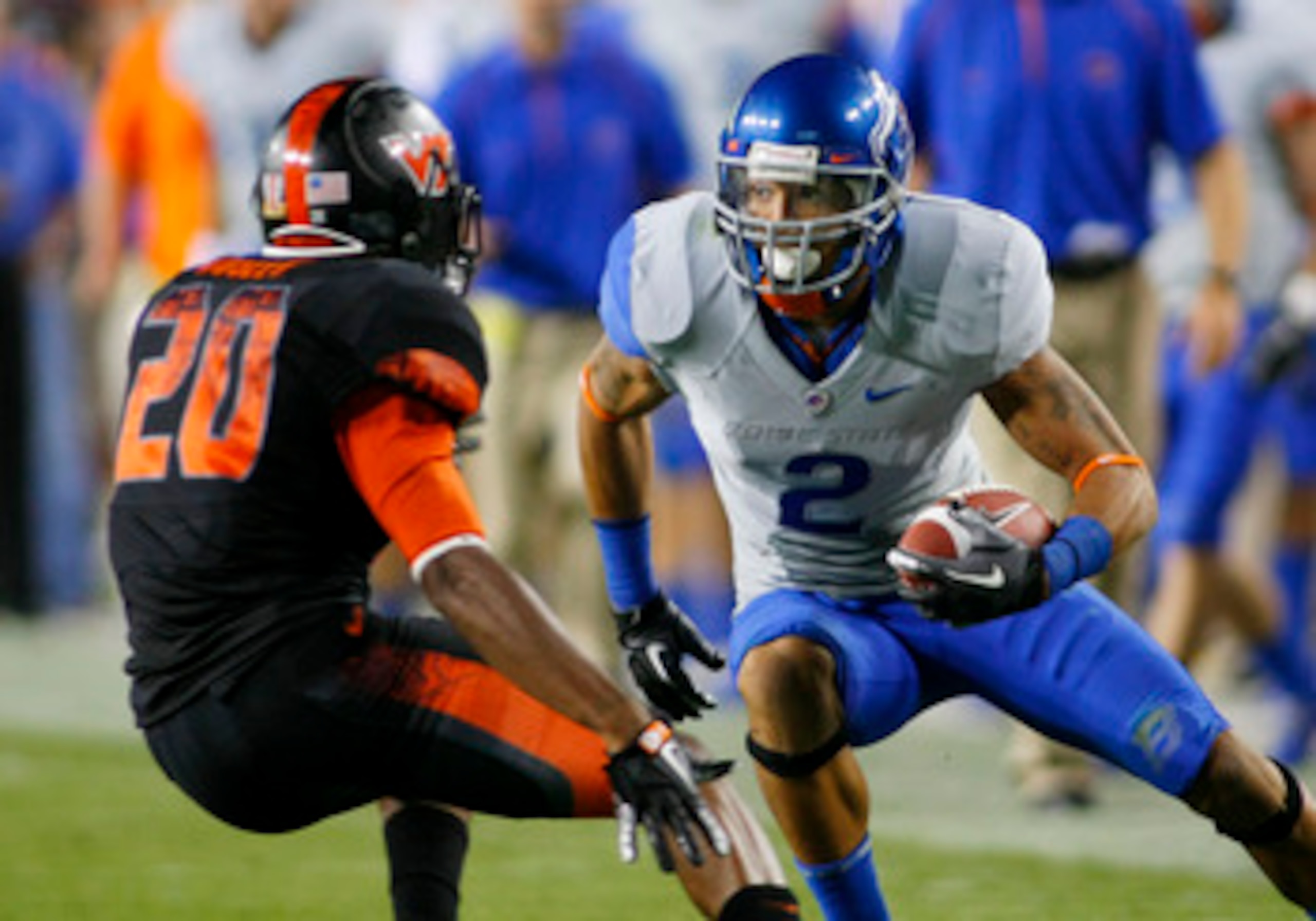 LANDOVER, MD - SEPTEMBER 06: Wide receiver #2 Austin Pettis of the Boise State Broncos tries to avoid cornerback #21 Rashad Carmichael of the Virginia Tech Hokies at FedExField on September 6, 2010 in Landover, Maryland. (Photo by Geoff Burke/Getty Imag LANDOVER, MD - SEPTEMBER 06: Wide receiver #2 Austin Pettis of the Boise State Broncos tries to avoid cornerback #21 Rashad Carmichael of the Virginia Tech Hokies at FedExField on September 6, 2010 in Landover, Maryland. (Photo by Geoff Burke/Getty Imag
