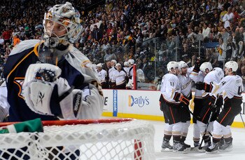 NASHVILLE, TN - APRIL 24:  Saku Koivu #11 and Cam Fowler #4 of the Anaheim Ducks celebrate a goal against Pekka Rinne #35 of the Nashville Predators in Game Six of the Western Conference Quarterfinals during the 2011 NHL Stanley Cup Playoffs at Bridgeston