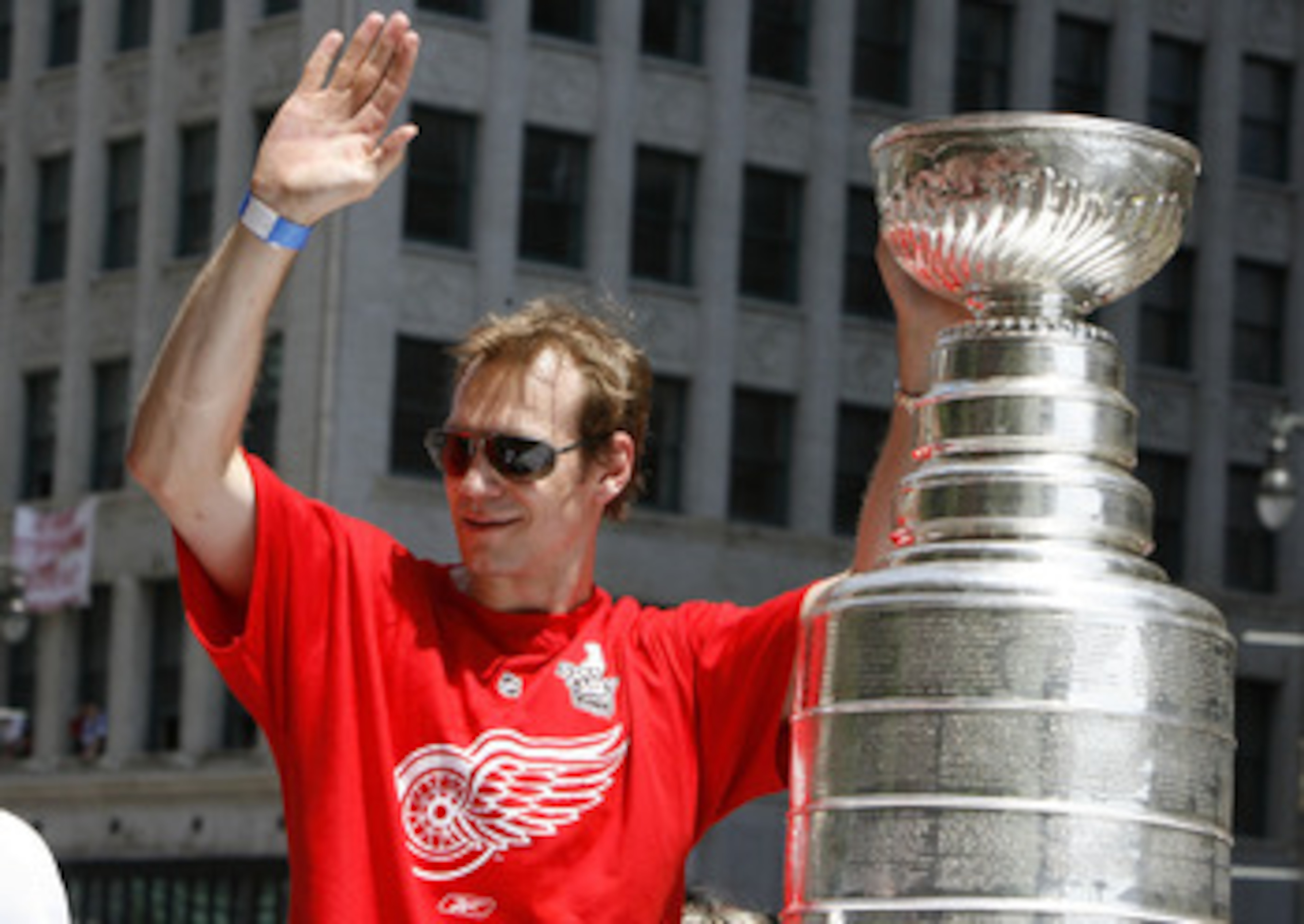 DETROIT - JUNE 06:  Nicklas Lidstrom #5 of the Detroit Red Wings waves to the crowd during a parade to celebrate winning the 2008 Stanley Cup on June 6, 2008 in Detroit, Michigan.  (Photo by Gregory Shamus/Getty Images)