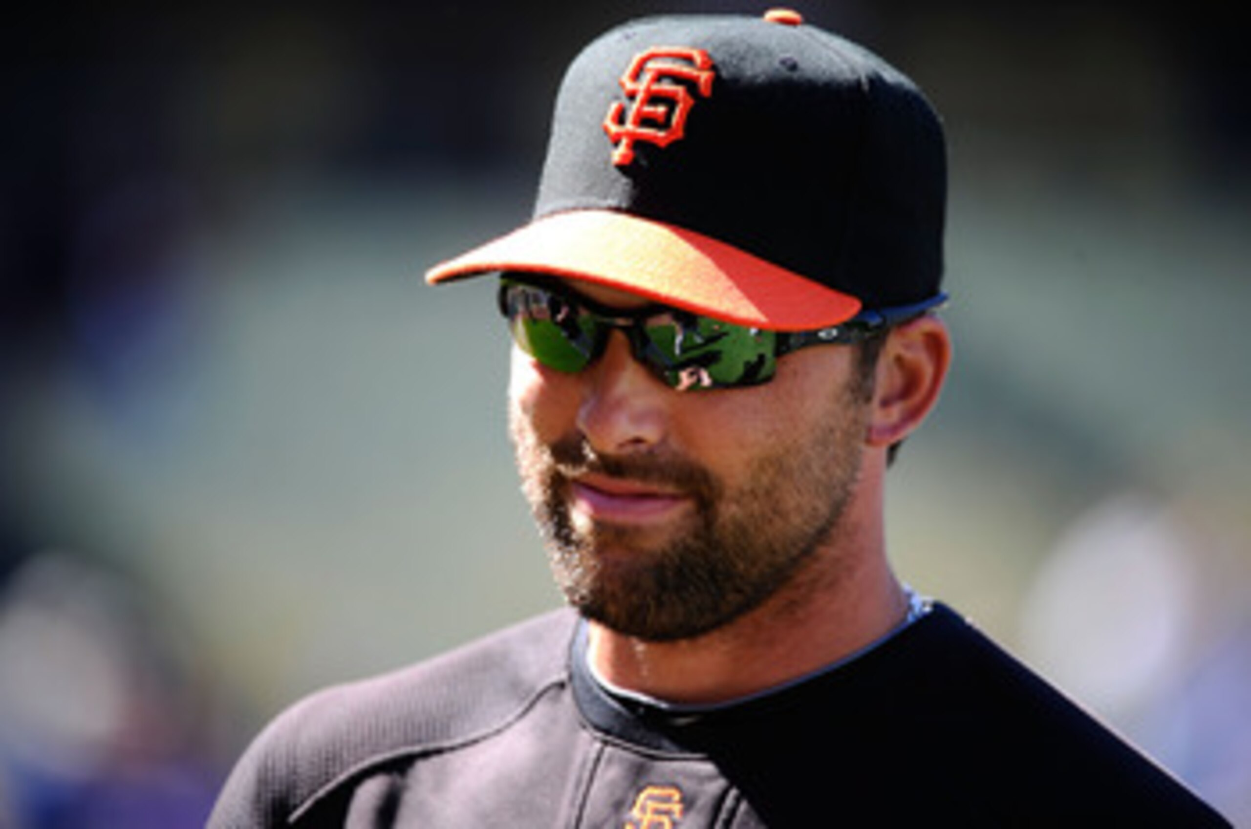 LOS ANGELES, CA - MARCH 31: Mark DeRosa #7 of the San Francisco Giants looks on during warm ups prior to playing the Los Angeles Dodgers on Opening Day at Dodger Stadium on March 31, 2011 in Los Angeles, California. (Photo by Kevork Djansezian/Getty Ima LOS ANGELES, CA - MARCH 31: Mark DeRosa #7 of the San Francisco Giants looks on during warm ups prior to playing the Los Angeles Dodgers on Opening Day at Dodger Stadium on March 31, 2011 in Los Angeles, California. (Photo by Kevork Djansezian/Getty Ima