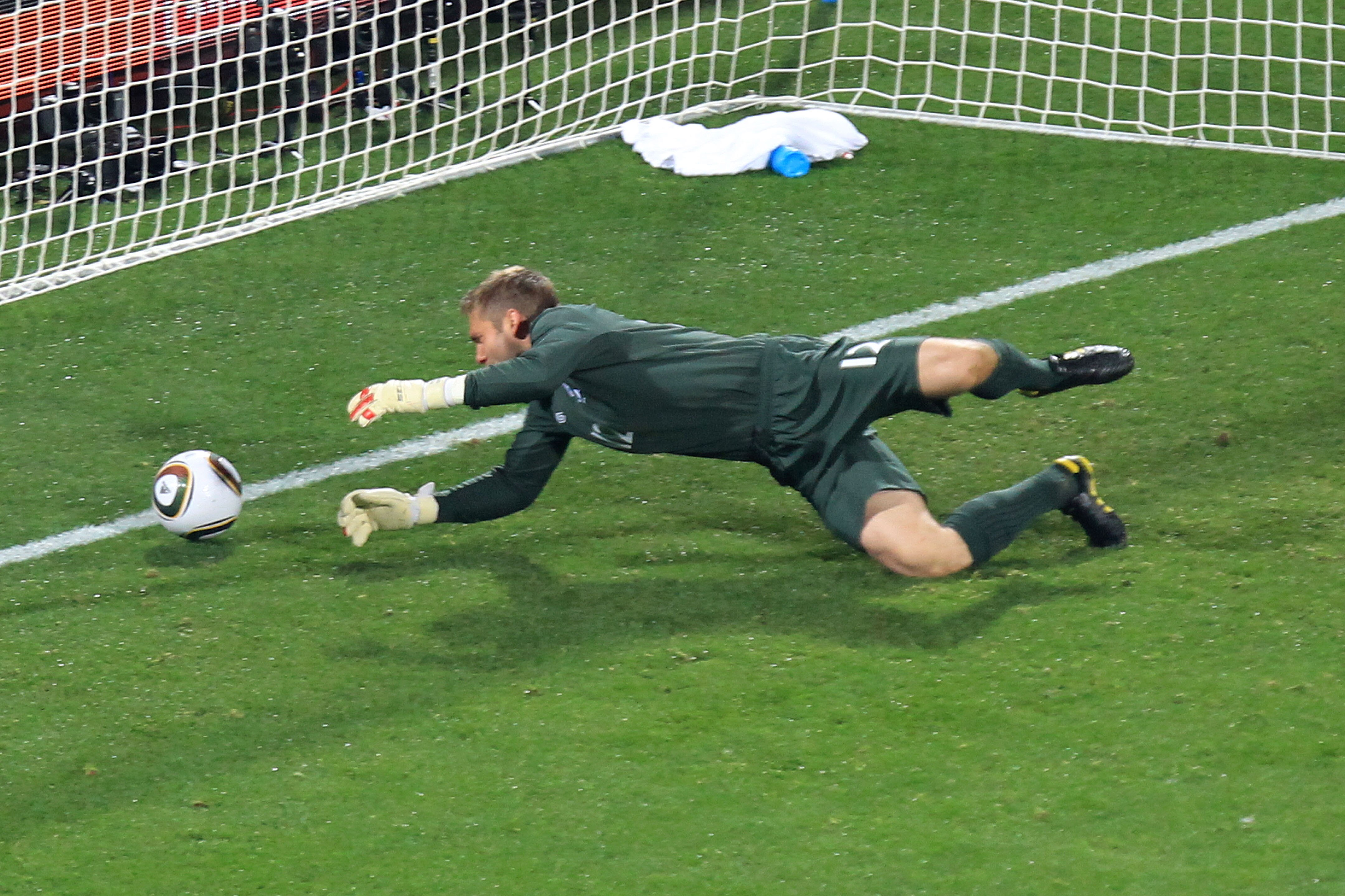 RUSTENBURG, SOUTH AFRICA - JUNE 12:  Robert Green of England misjudges the ball and lets in a goal during the 2010 FIFA World Cup South Africa Group C match between England and USA at the Royal Bafokeng Stadium on June 12, 2010 in Rustenburg, South Africa