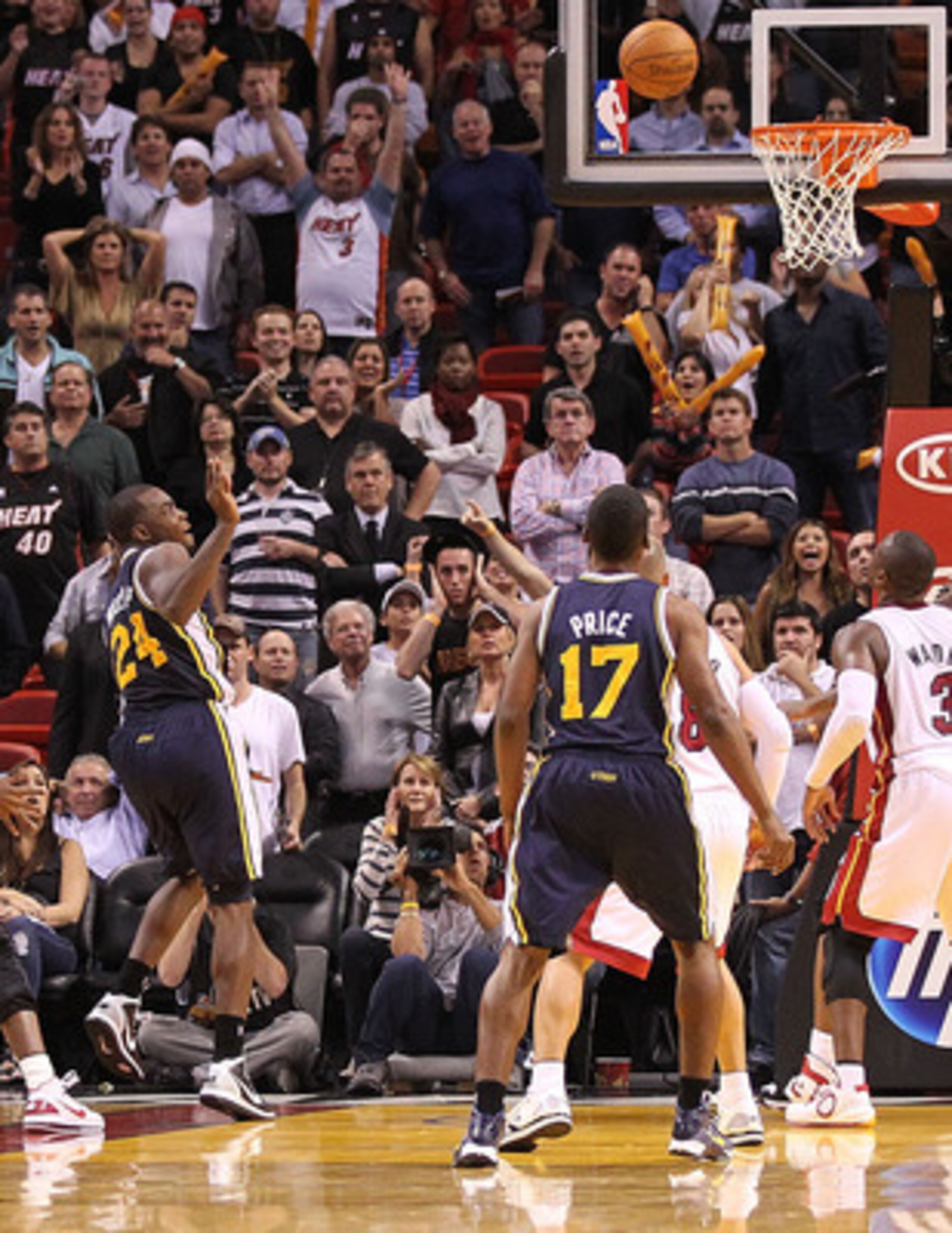 MIAMI - NOVEMBER 09:  Paul Millsap #24 of the Utah Jazz tips in a rebound during the final second to send the game into overtime against the Miami Heat at American Airlines Arena on November 9, 2010 in Miami, Florida. NOTE TO USER: User expressly acknowle
