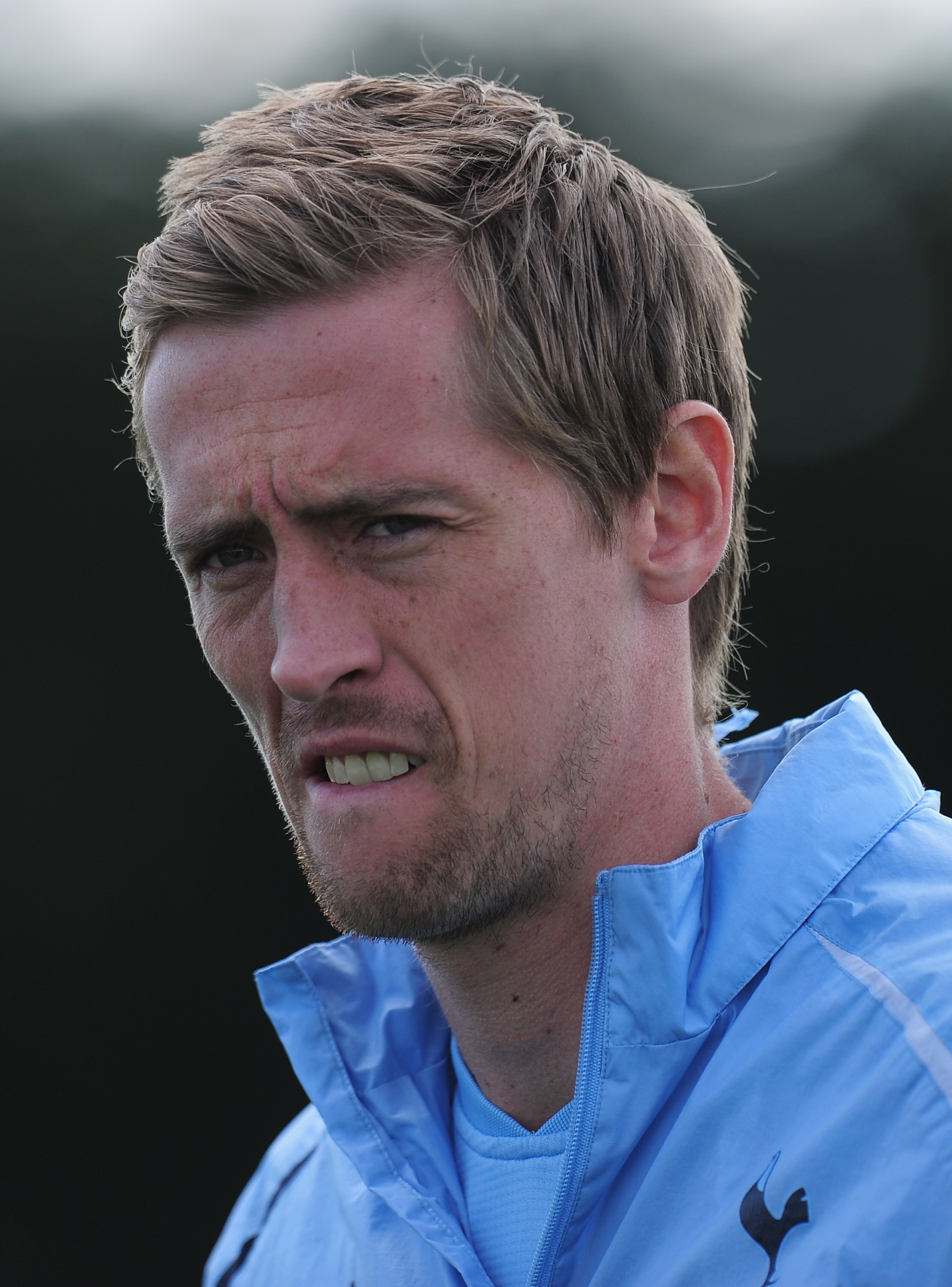 CHIGWELL, ENGLAND - APRIL 12:  Peter Crouch of Tottenham Hotspur looks on during a training session on the eve of their UEFA Champions League quarter-final second leg match against Real Madrid at Spurs Lodge on April 12, 2011 in Chigwell, England.  (Photo