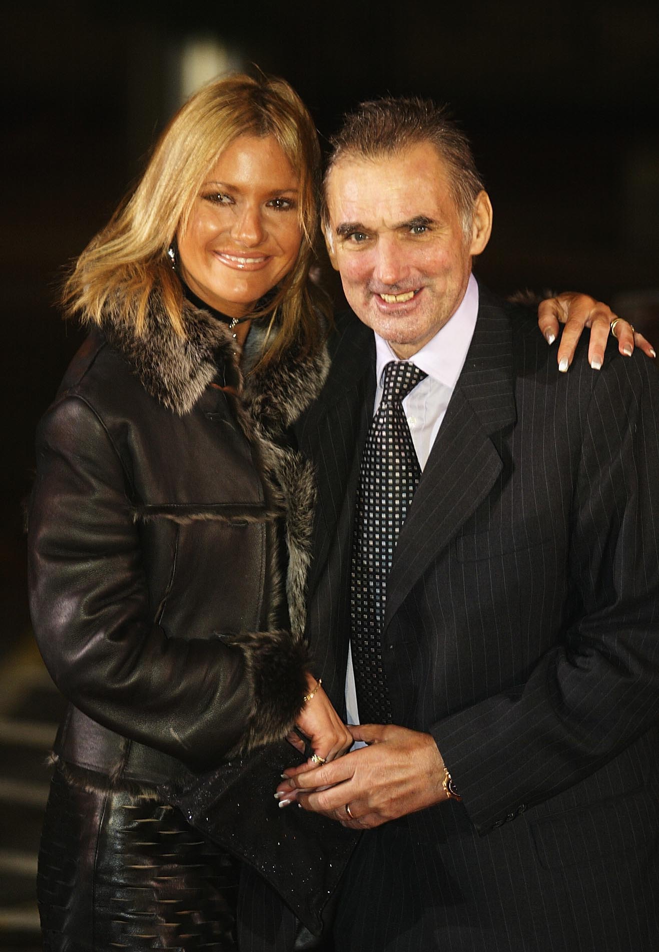LONDON - DECEMBER 8:   George Best poses with his wife Alex as they arrive for the BBC Sports Personality of the Year Awards held at the BBC Television Centre in London, December 8, 2002. (Photo by Warren Little/Getty Images)