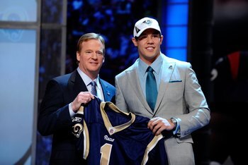 NEW YORK - APRIL 22:  Quarterback Sam Bradford (R) from the Oklahoma Sooners poses with NFL Commissioner Roger Goodell as they hold up a St. Louis Rams jersey after the Rams selected Bradford numer 1 overall during the first round of the 2010 NFL Draft at