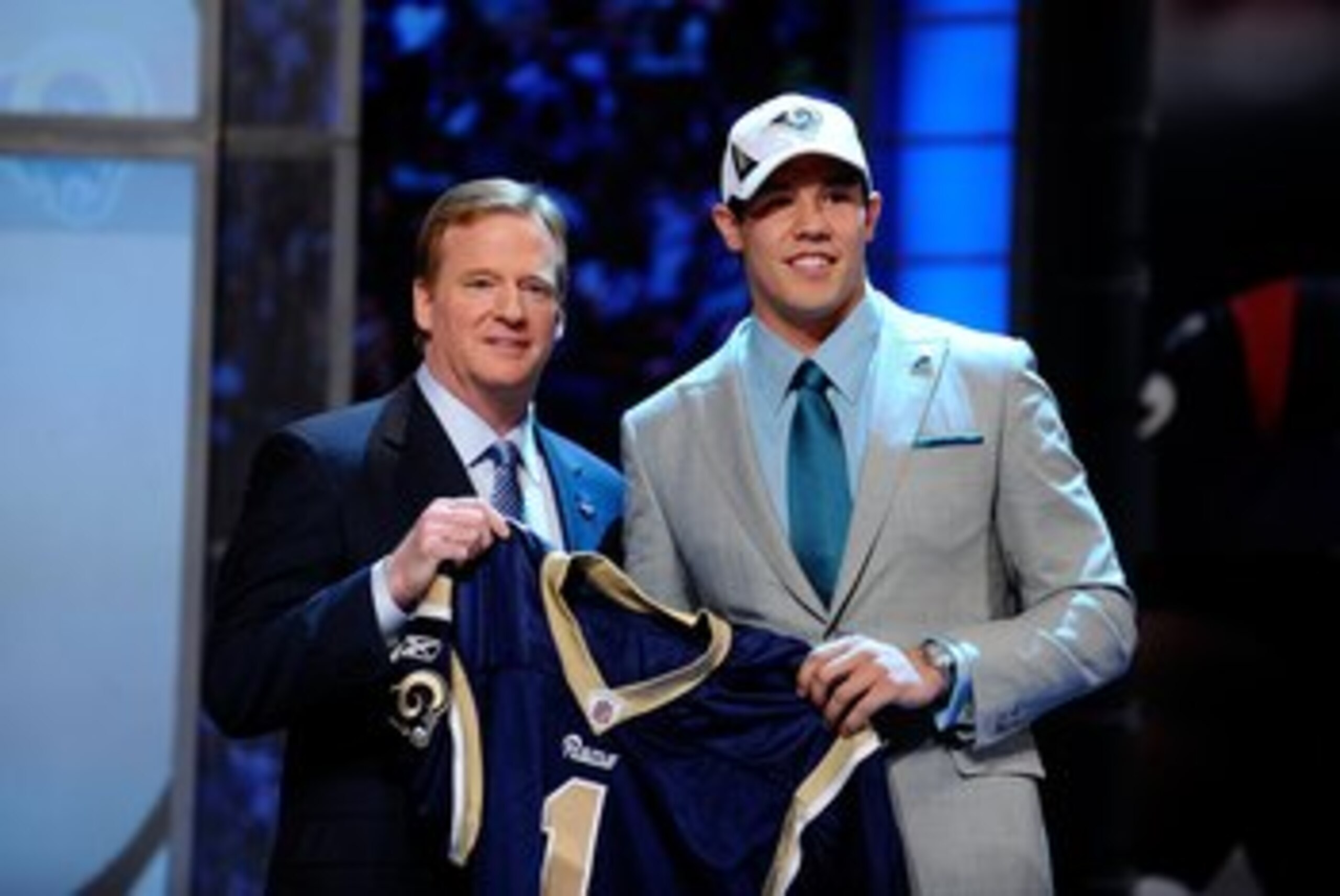 NEW YORK - APRIL 22: Quarterback Sam Bradford (R) from the Oklahoma Sooners poses with NFL Commissioner Roger Goodell as they hold up a St. Louis Rams jersey after the Rams selected Bradford numer 1 overall during the first round of the 2010 NFL Draft at NEW YORK - APRIL 22: Quarterback Sam Bradford (R) from the Oklahoma Sooners poses with NFL Commissioner Roger Goodell as they hold up a St. Louis Rams jersey after the Rams selected Bradford numer 1 overall during the first round of the 2010 NFL Draft at