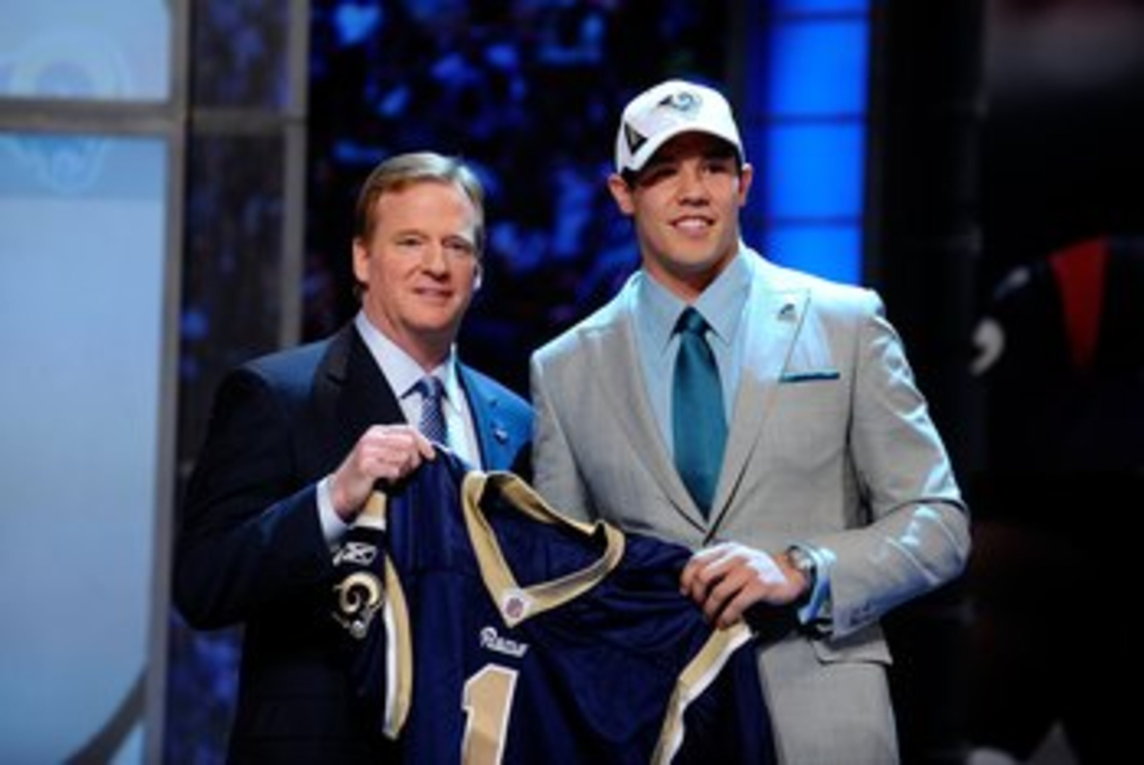 NEW YORK - APRIL 22:  Quarterback Sam Bradford (R) from the Oklahoma Sooners poses with NFL Commissioner Roger Goodell as they hold up a St. Louis Rams jersey after the Rams selected Bradford numer 1 overall during the first round of the 2010 NFL Draft at