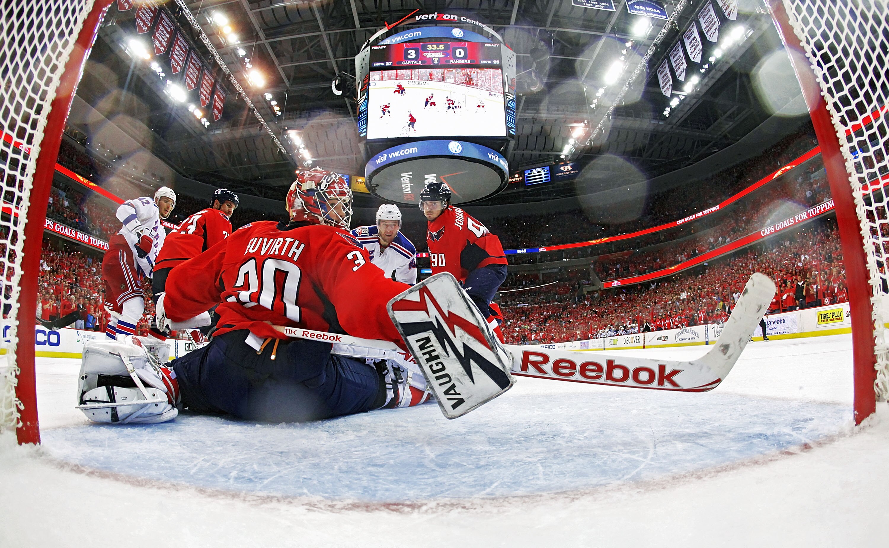 WASHINGTON, DC - APRIL 23:  Michal Neuvirth #30 of the Washington Capitals watches the only goal of the New York Rangers sail into the net in Game Five of the Eastern Conference Quarterfinals during the 2011 NHL Stanley Cup Playoffs at the Verizon Center 