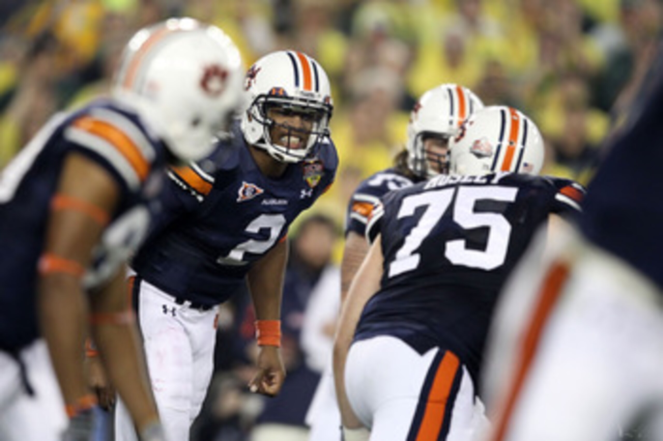 GLENDALE, AZ - JANUARY 10:  Cameron Newton #2 of the Auburn Tigersc reacts with his team against the Oregon Ducks during the Tostitos BCS National Championship Game at University of Phoenix Stadium on January 10, 2011 in Glendale, Arizona.  (Photo by Chri