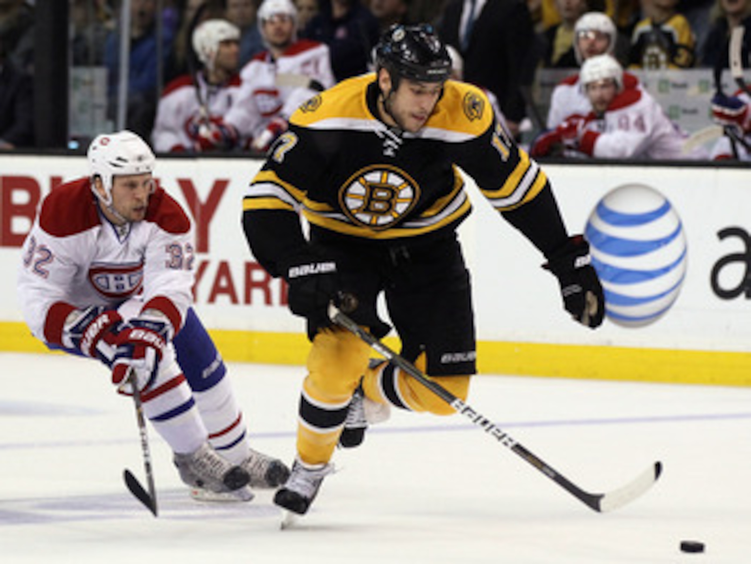 BOSTON, MA - APRIL 23: Milan Lucic #17 of the Boston Bruins takes the puck as Travis Moen #32 of the Montreal Canadiens defends in Game Five of the Eastern Conference Quarterfinals during the 2011 NHL Stanley Cup Playoffs at TD Garden on April 23, 2011 i BOSTON, MA - APRIL 23: Milan Lucic #17 of the Boston Bruins takes the puck as Travis Moen #32 of the Montreal Canadiens defends in Game Five of the Eastern Conference Quarterfinals during the 2011 NHL Stanley Cup Playoffs at TD Garden on April 23, 2011 i