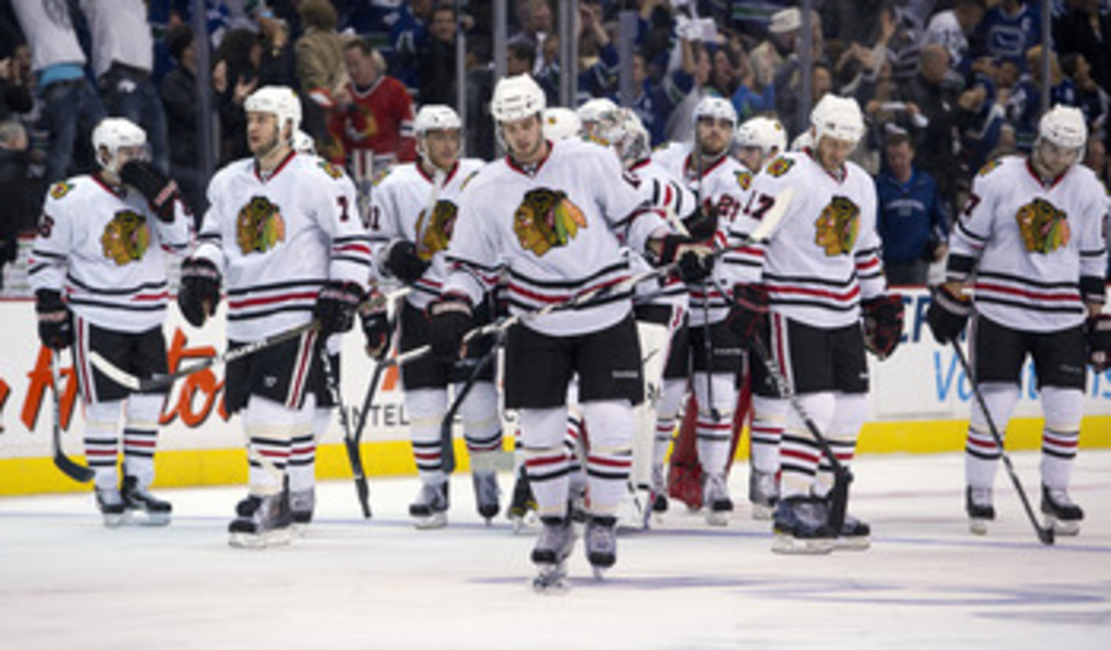 VANCOUVER, CANADA - APRIL 26: The Chicago Blackhawks wait dejectedly for the handshake with the Vancouver Canucks after losing 2-1 in overtime of Game Seven of the Western Conference Quarterfinals during the 2011 NHL Stanley Cup Playoffs on April 26, 2011