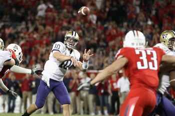 TUCSON, AZ - OCTOBER 23:  Quarterback Jake Locker #10 of the Washington Huskies drops back to pass during the college football game against the Arizona Wildcats at Arizona Stadium on October 23, 2010 in Tucson, Arizona. The Wildcats defeated the Huskies 4