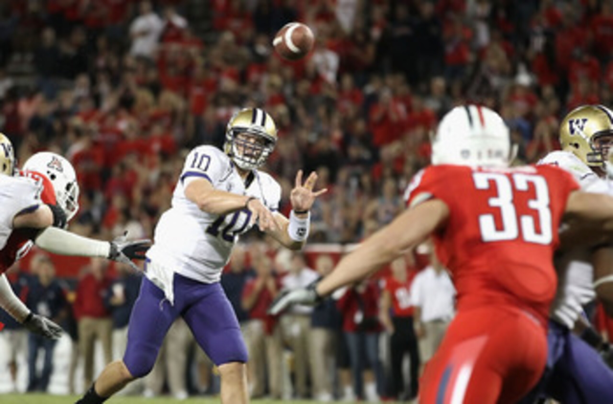 TUCSON, AZ - OCTOBER 23:  Quarterback Jake Locker #10 of the Washington Huskies drops back to pass during the college football game against the Arizona Wildcats at Arizona Stadium on October 23, 2010 in Tucson, Arizona. The Wildcats defeated the Huskies 4