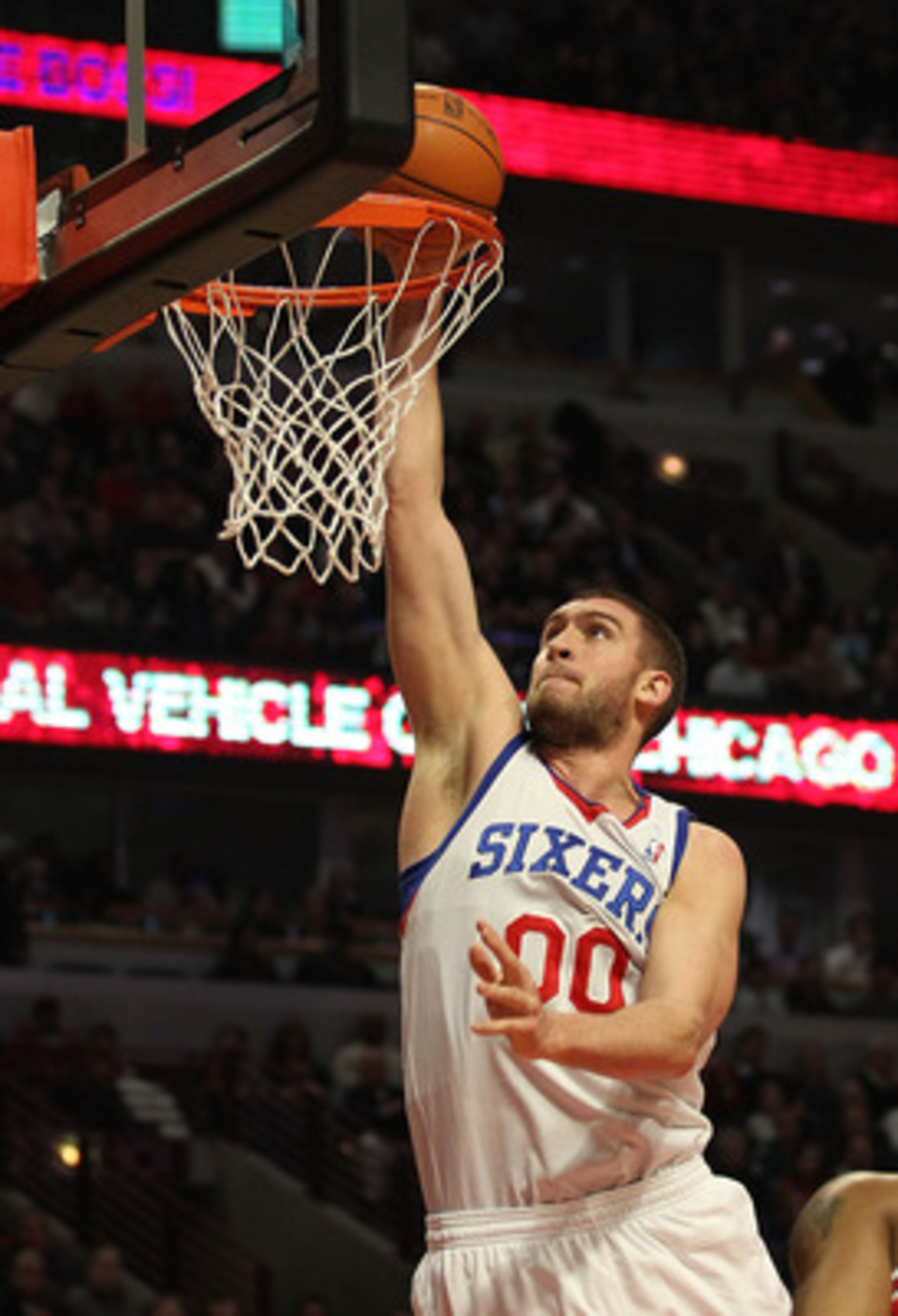 CHICAGO, IL - MARCH 28: Spencer Hawes #00 of the Philadelphia 76ers dunks the ball against the Chicago Bulls at the United Center on March 28, 2011 in Chicago, Illinois. NOTE TO USER: User expressly acknowledges and agrees that, by downloading and/or usin