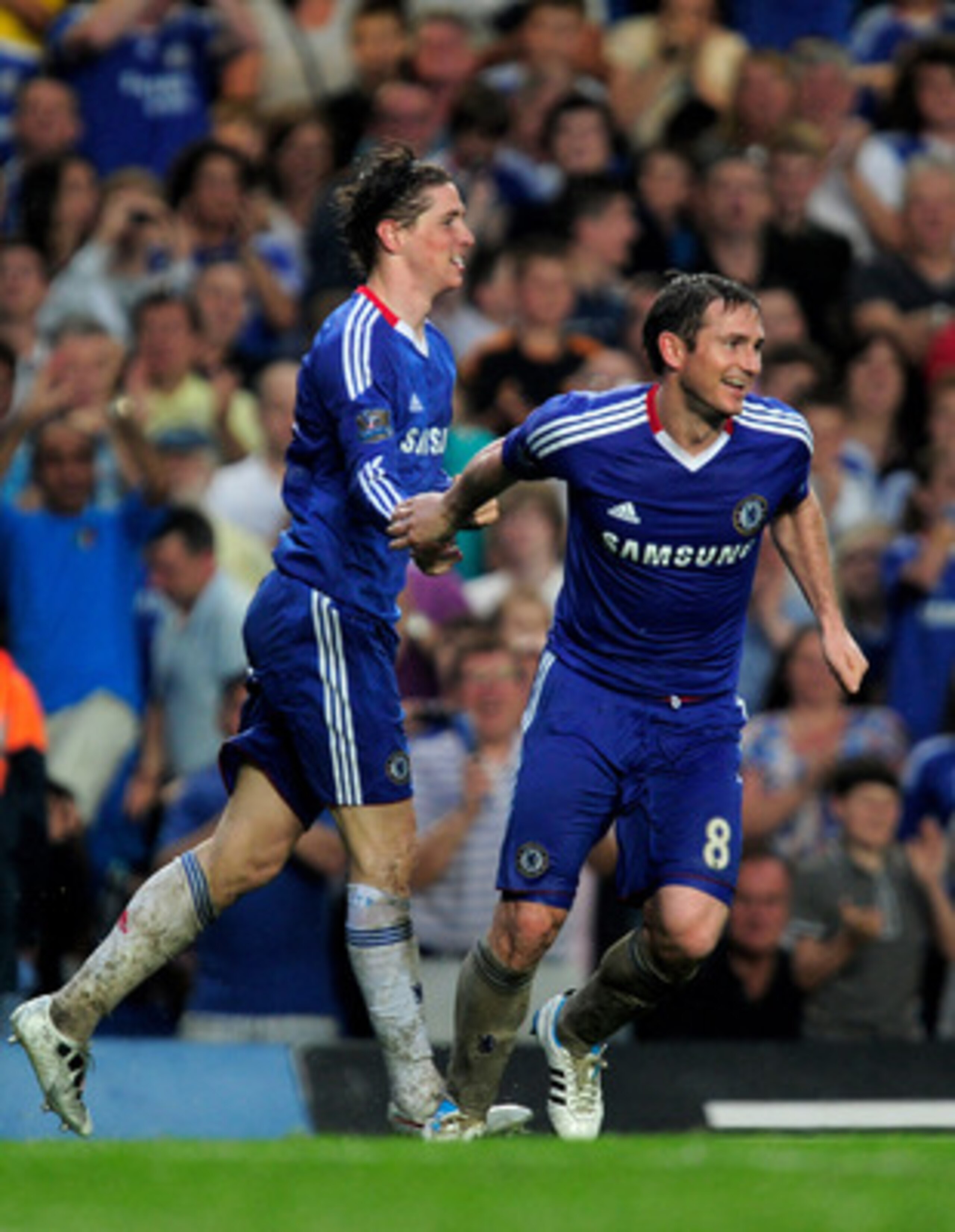 LONDON, ENGLAND - APRIL 23:  Fernando Torres (L) of Chelsea celebrates with teammate Frank Lampard after scoring his team's second goal and the first of his Chelsea career during the Barclays Premier League match between Chelsea and West Ham United at Sta