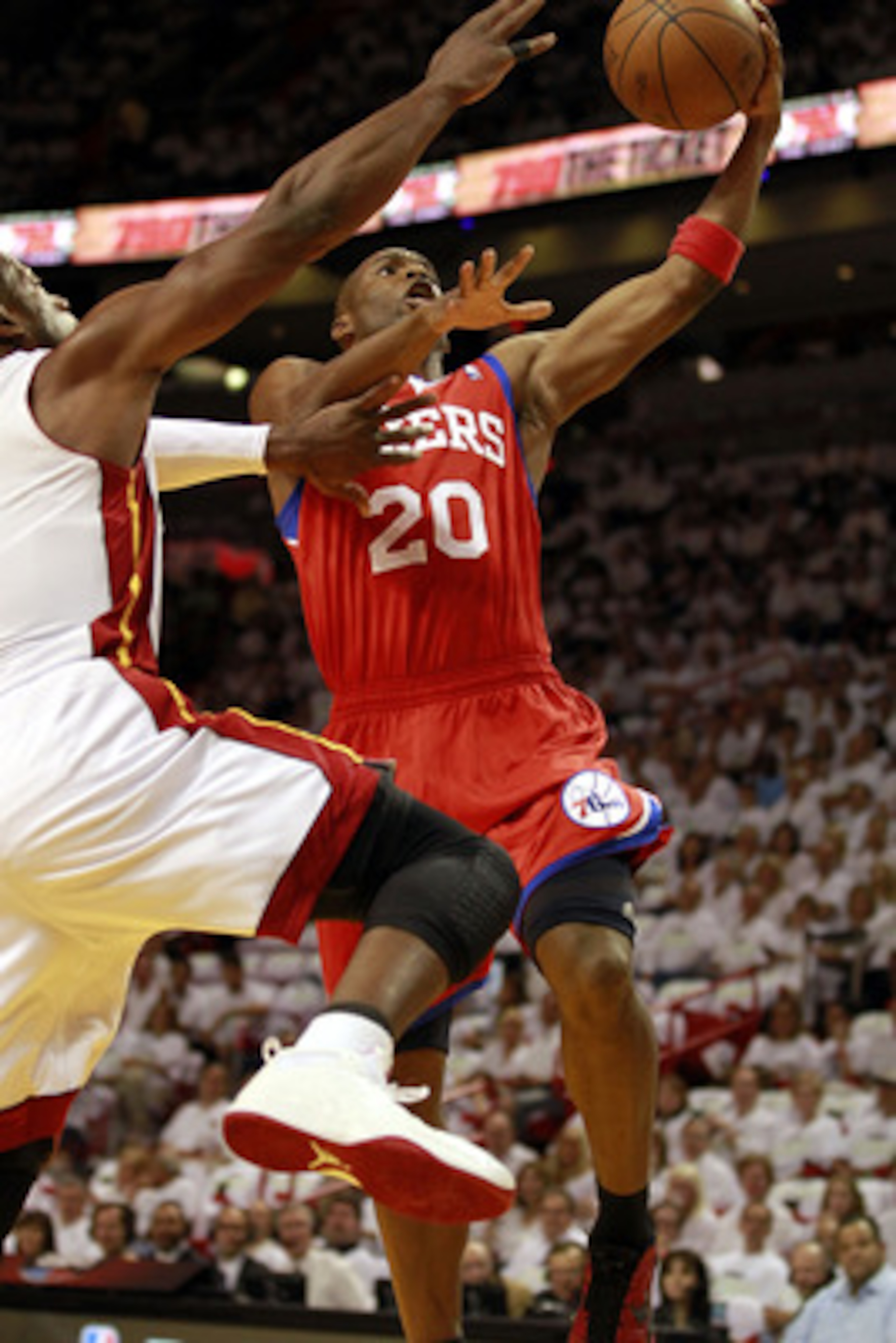 MIAMI, FL - APRIL 16: Guard Jodie Meeks #20 of the Philadelphia 76ers drives against Dwyane Wade #3 of the Miami Heat at the American Airlines Arena in Game One of the Eastern Conference Quarterfinals in the 2011 NBA Playoffs on April 16, 2011 in Miami, F