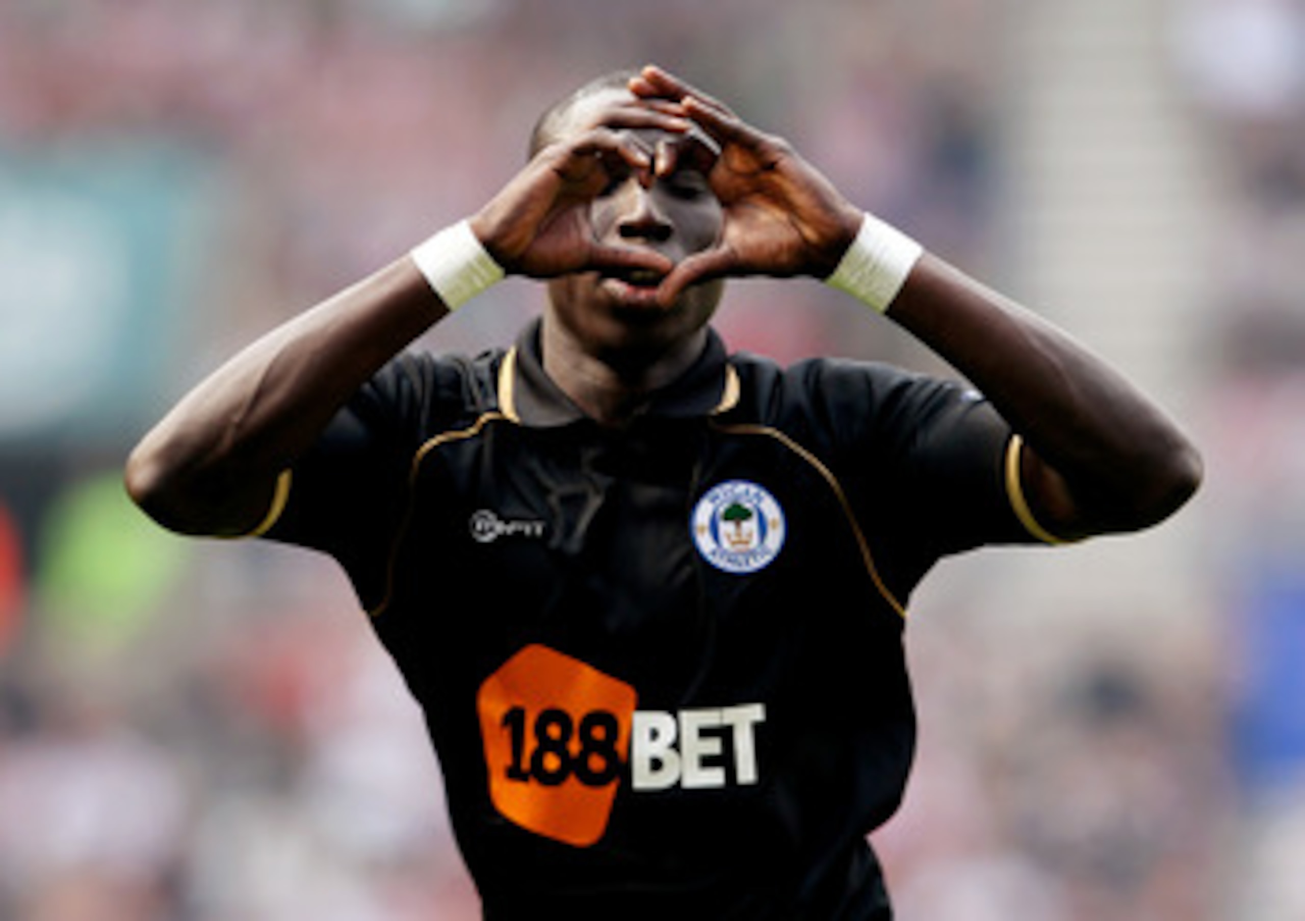 SUNDERLAND, ENGLAND - APRIL 23: Mohamed Diame of Wigan celebrates after scoring their first goal during the Barclays Premier League match between Sunderland and Wigan Athletic at Stadium of Light on April 23, 2011 in Sunderland, England.  (Photo by Scott 