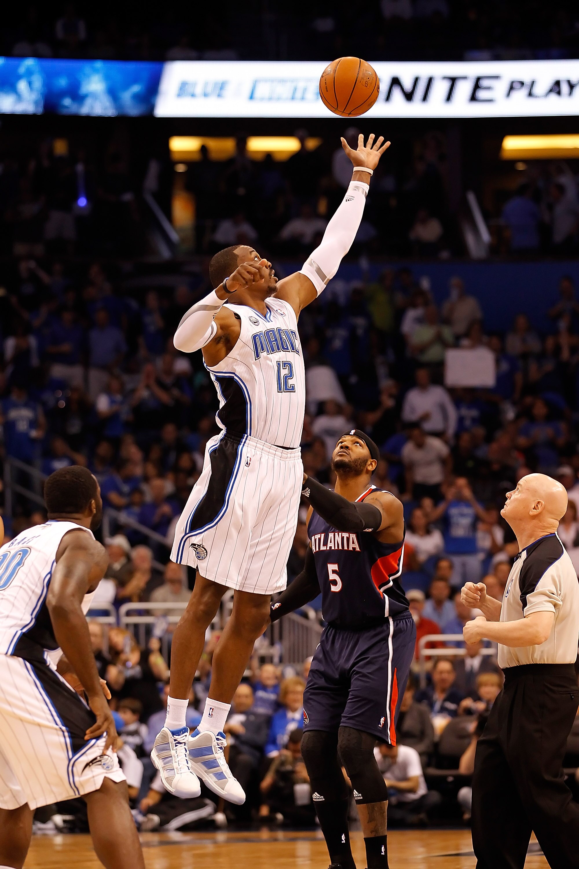 ORLANDO, FL - APRIL 26:  Dwight Howard #12 of the Orlando Magic wins the opening tip against the Atlanta Hawks during Game Five of the Eastern Conference Quarterfinals of the 2011 NBA Playoffs on April 26, 2011 at the Amway Arena in Orlando, Florida.  NOT