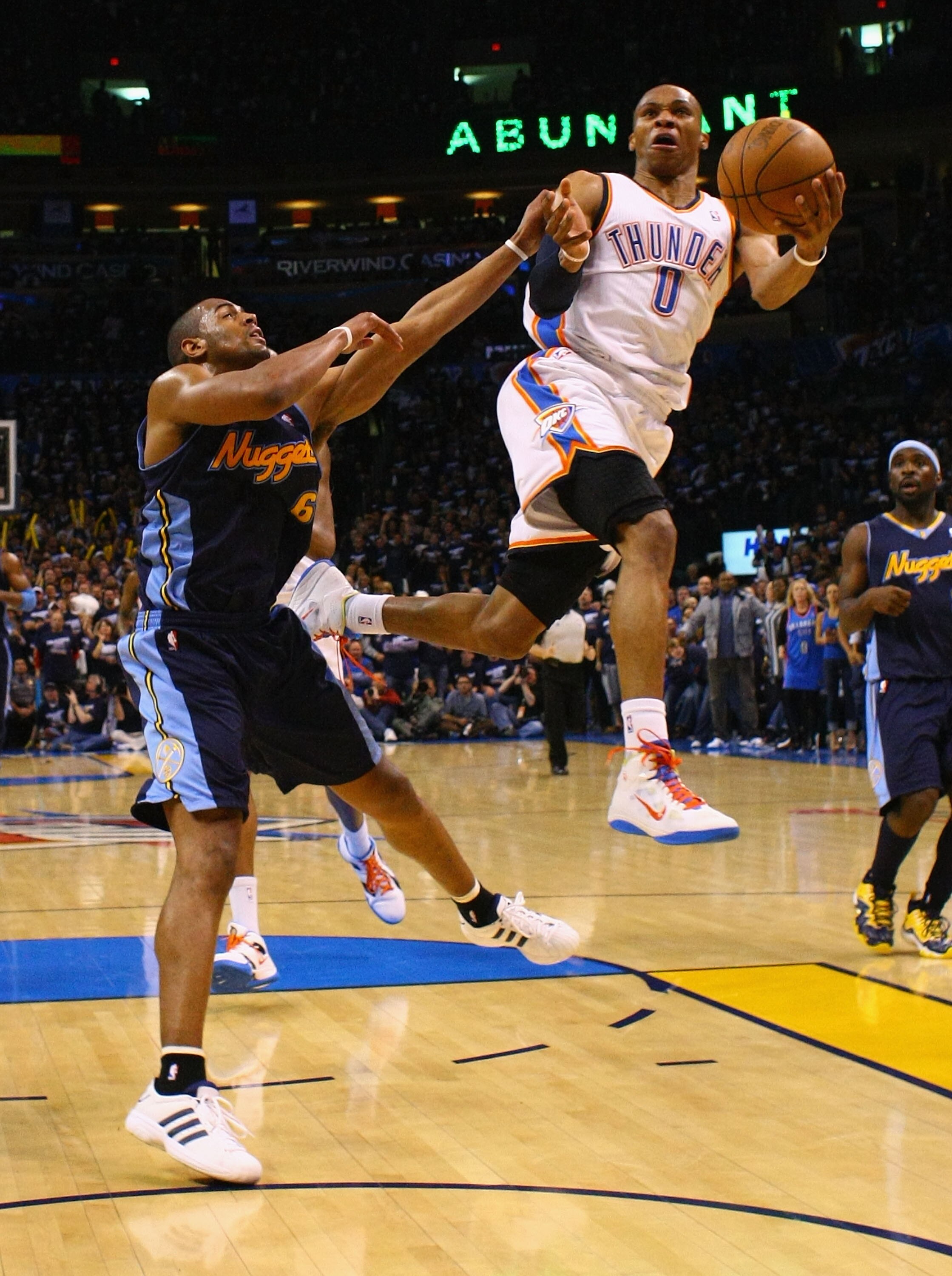 OKLAHOMA CITY, OK - APRIL 27: Russell Westbrook #0 of the Oklahoma City Thunder drives to the basket against Arron Afflalo #6 of the Denver Nuggets in Game Five of the Western Conference Quarterfinals in the 2011 NBA Playoffs on April 27, 2011 at the Ford