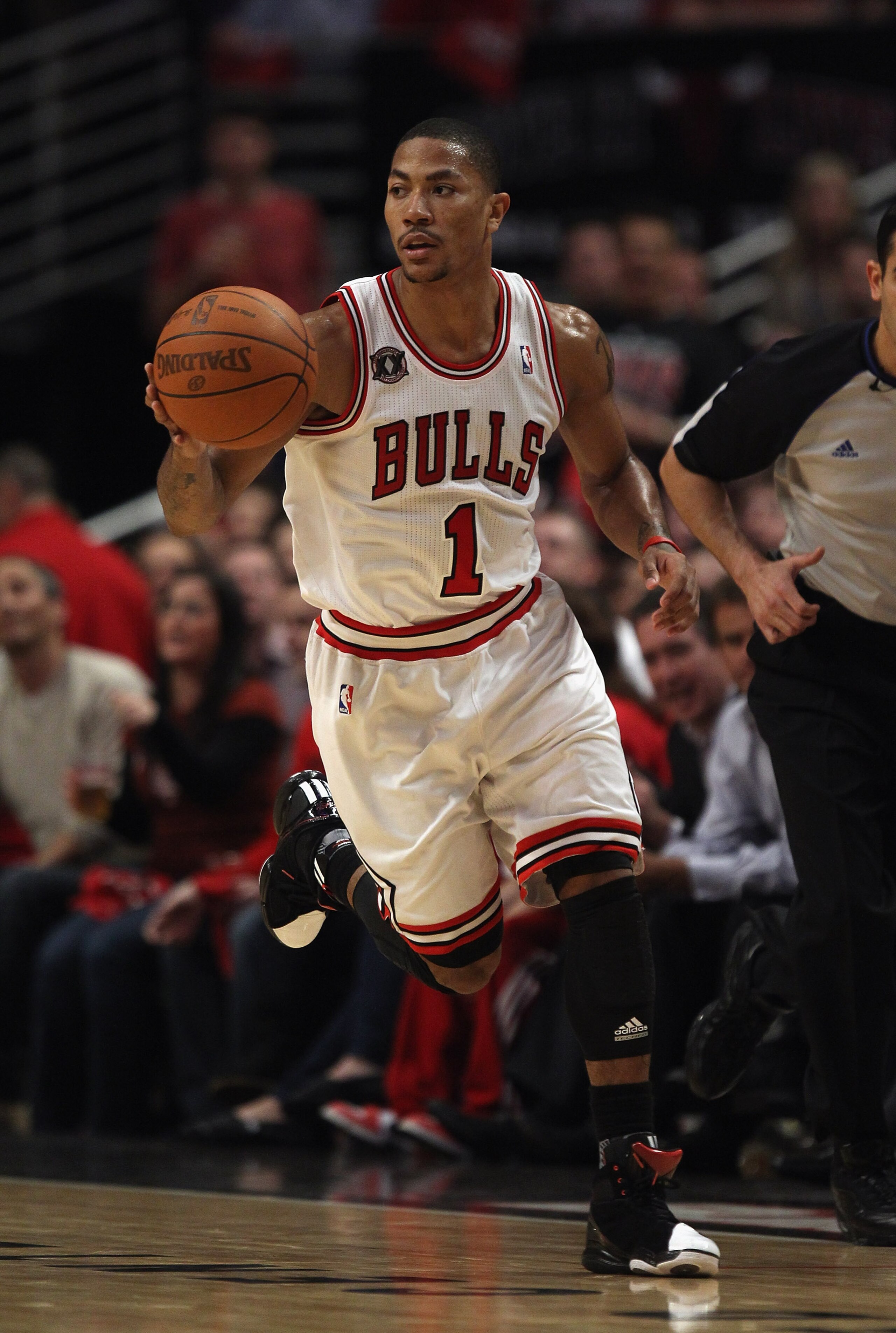 CHICAGO, IL - APRIL 26: Derrick Rose #1 of the Chicago Bulls moves up the court against the Indiana Pacers in Game Five of the Eastern Conference Quarterfinals in the 2011 NBA Playoffs at the United Center on April 26, 2011 in Chicago, Illinois. The Bulls CHICAGO, IL - APRIL 26: Derrick Rose #1 of the Chicago Bulls moves up the court against the Indiana Pacers in Game Five of the Eastern Conference Quarterfinals in the 2011 NBA Playoffs at the United Center on April 26, 2011 in Chicago, Illinois. The Bulls