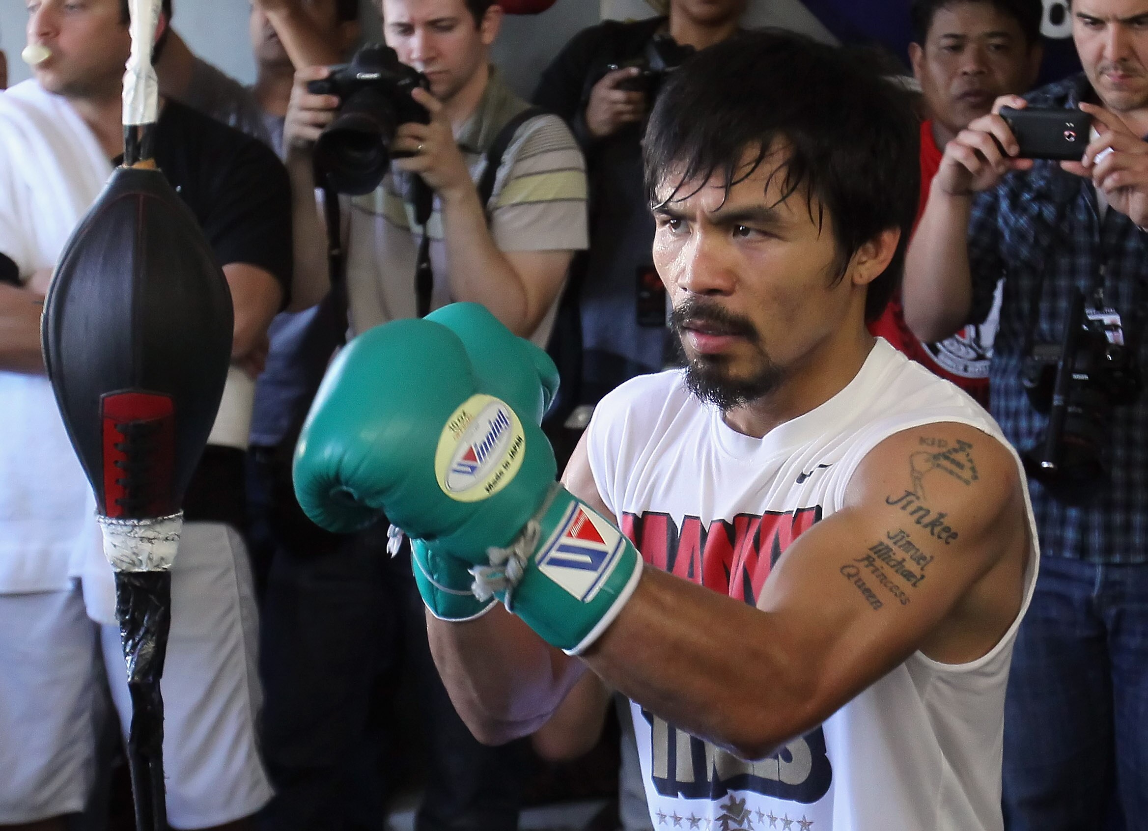 HOLLYWOOD, CA - APRIL 20:  Manny Pacquiao of the Philippines trains on the speed bag during a media workout at the Wild Card Boxing Club on April 20, 2011 in Hollywood, California.  (Photo by Jeff Gross/Getty Images)