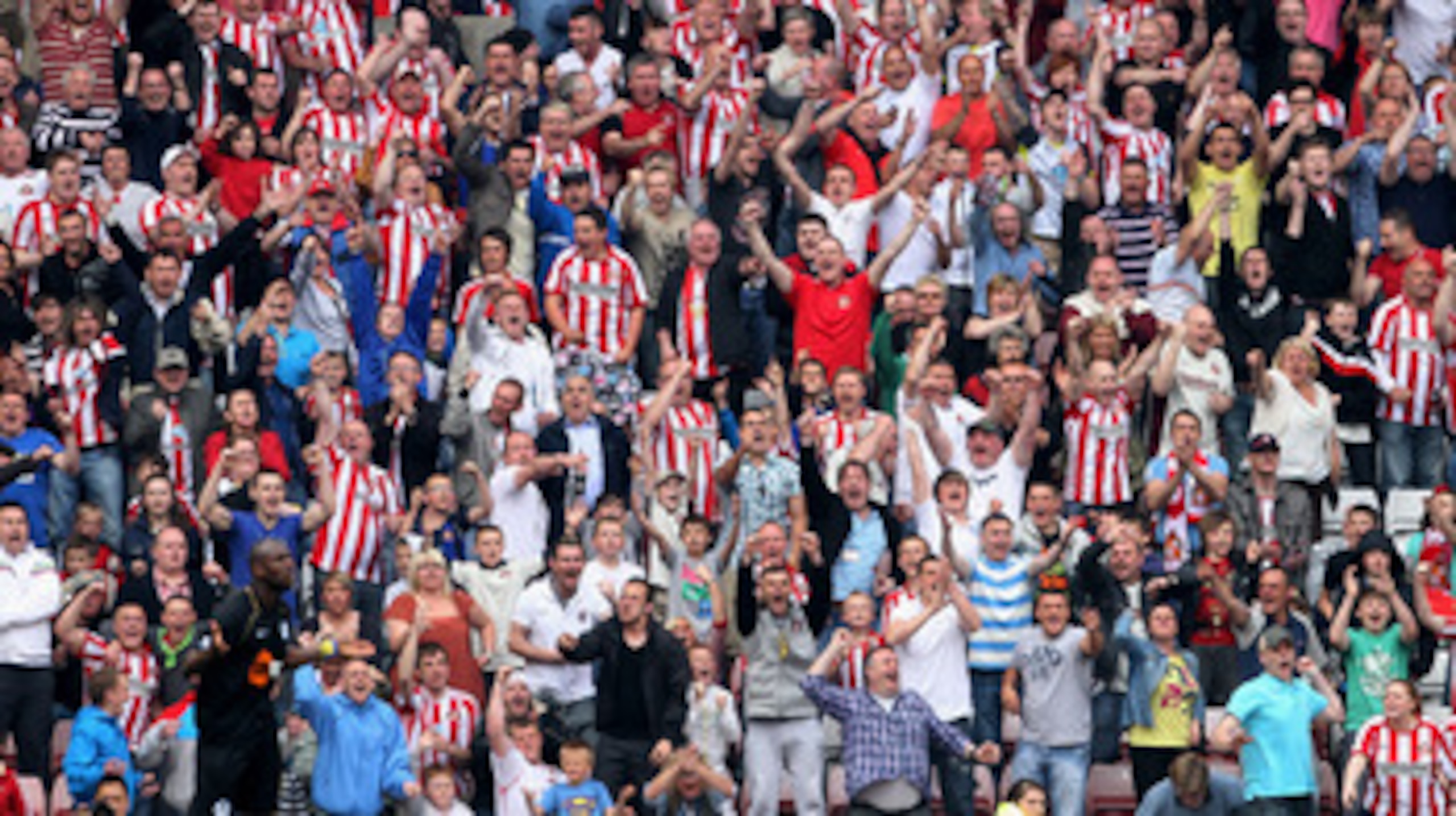 SUNDERLAND, ENGLAND - APRIL 23:  Sunderland fans celebrate after winning a penaltyduring the Barclays Premier League match between Sunderland and Wigan Athletic at Stadium of Light on April 23, 2011 in Sunderland, England.  (Photo by Scott Heavey/Getty Im