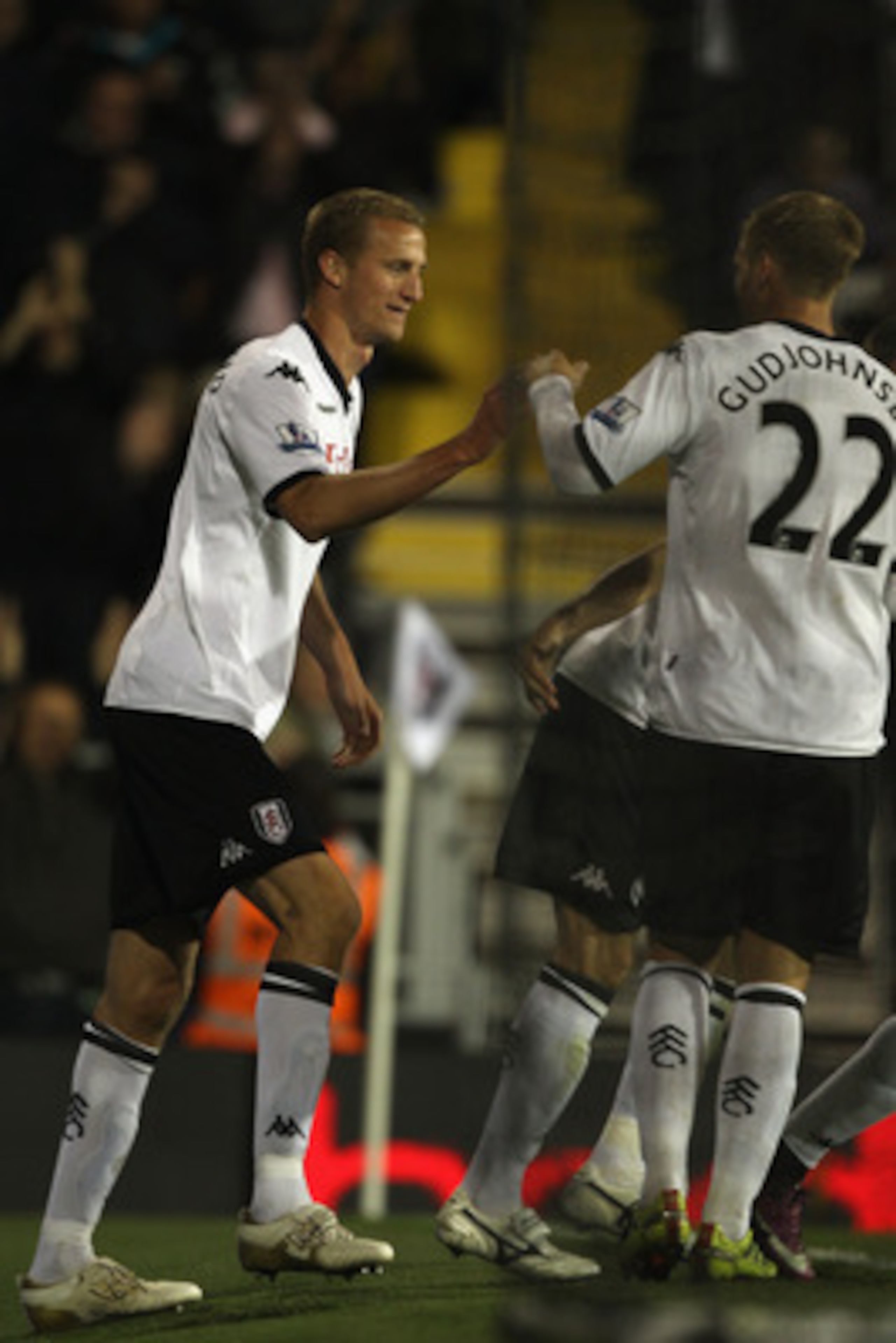 LONDON, ENGLAND - APRIL 27:  Brede Hangeland (L) of Fulham celebrates scoring his sides third goal with Eidur Gudjohnsen during the Barclays Premier League match between Fulham and Bolton Wanderers at Craven Cottage on April 27, 2011 in London, England.  