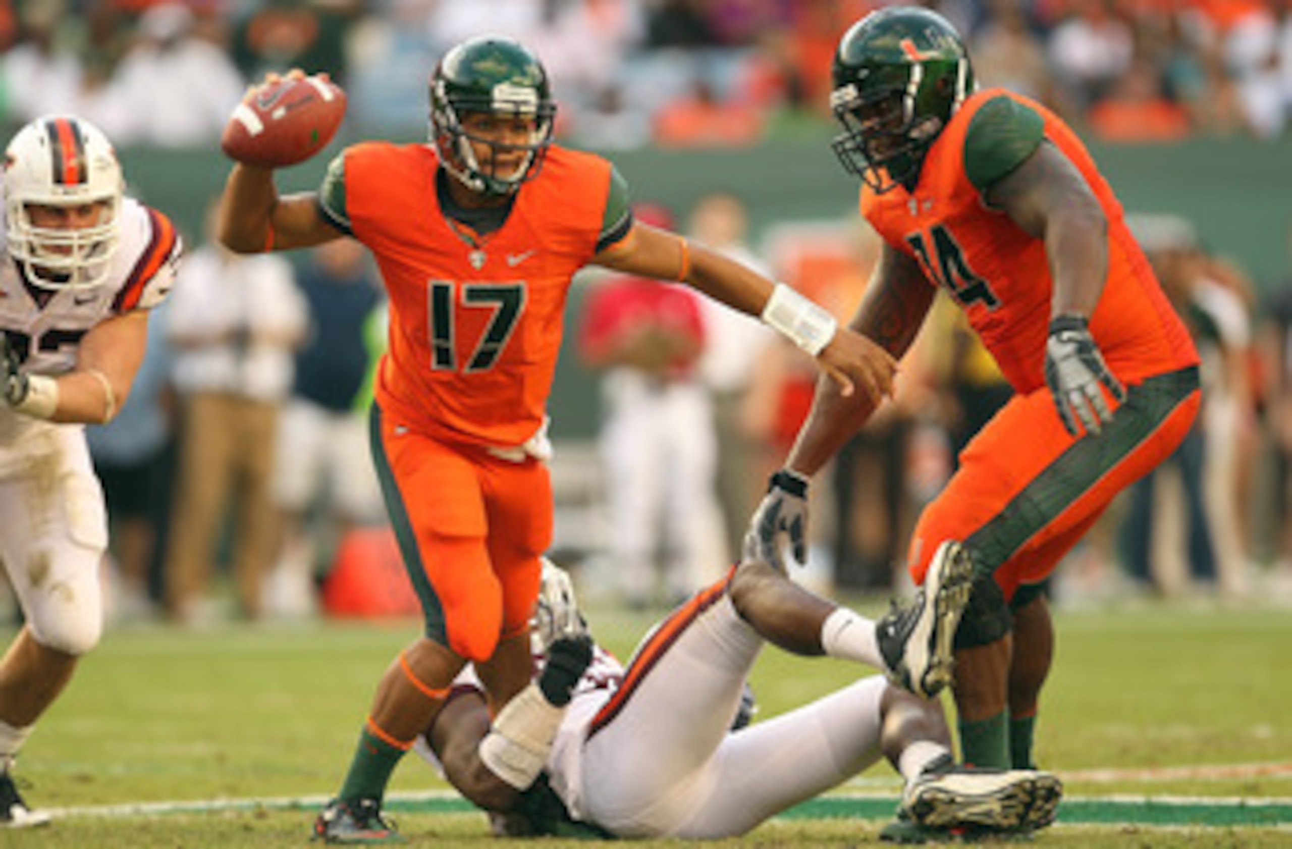 MIAMI - NOVEMBER 20:  Stephen Morris #17 of the Miami Hurricanes passes out of trouble during a game against the Virginia Tech Hokies at Sun Life Stadium on November 20, 2010 in Miami, Florida.  (Photo by Mike Ehrmann/Getty Images)