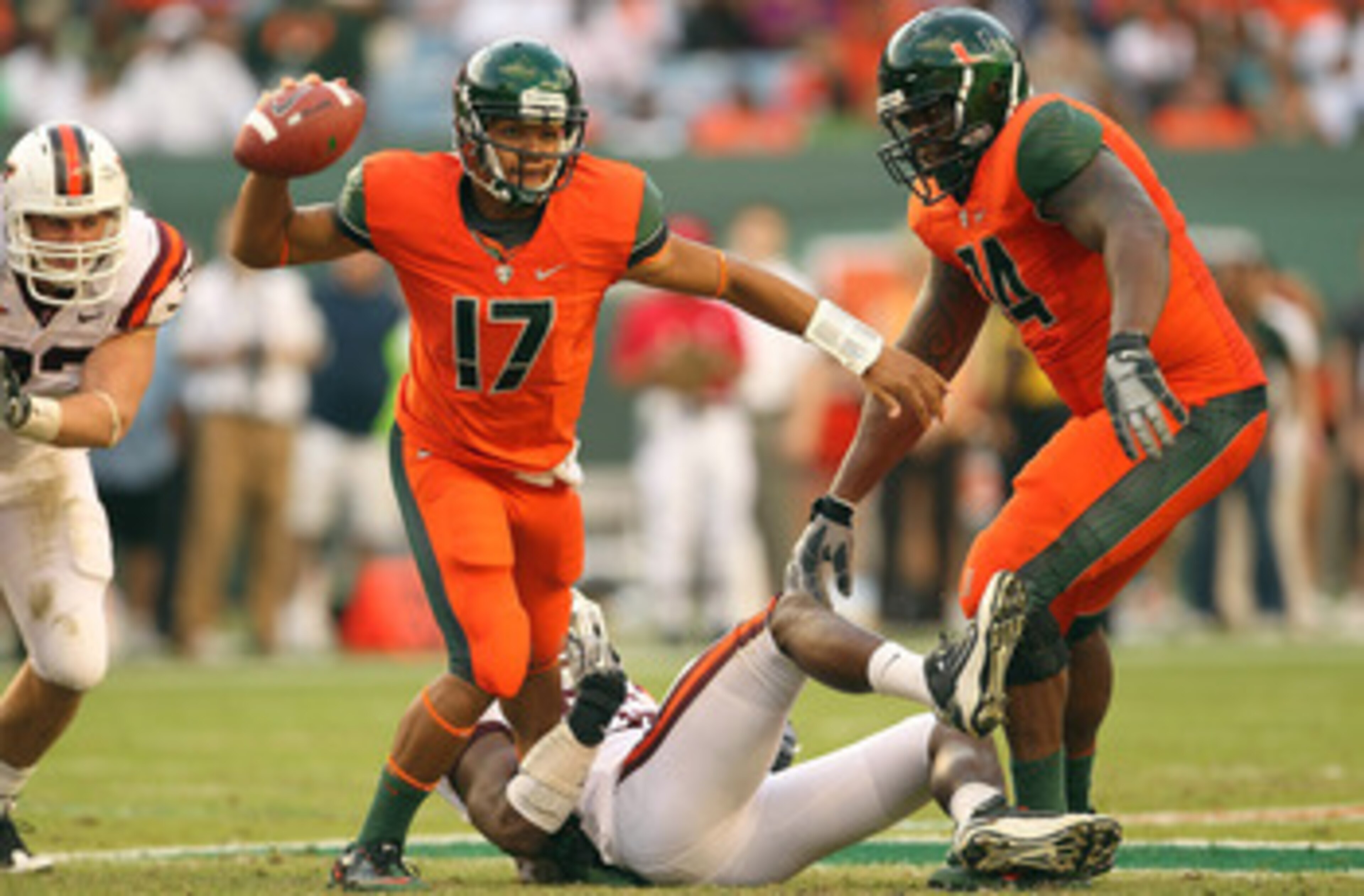 MIAMI - NOVEMBER 20:  Stephen Morris #17 of the Miami Hurricanes passes out of trouble during a game against the Virginia Tech Hokies at Sun Life Stadium on November 20, 2010 in Miami, Florida.  (Photo by Mike Ehrmann/Getty Images)